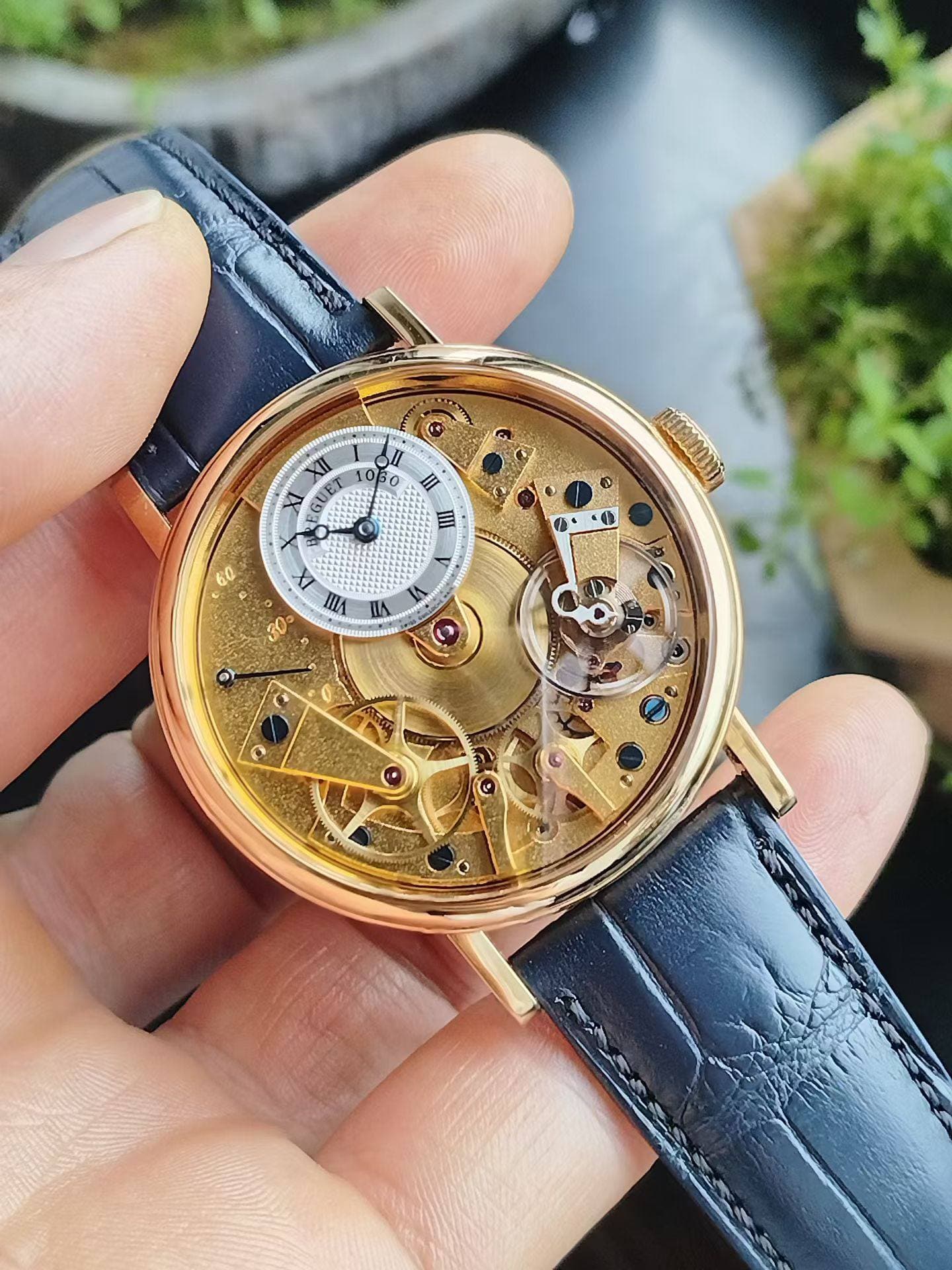 May be an image of wrist watch and text