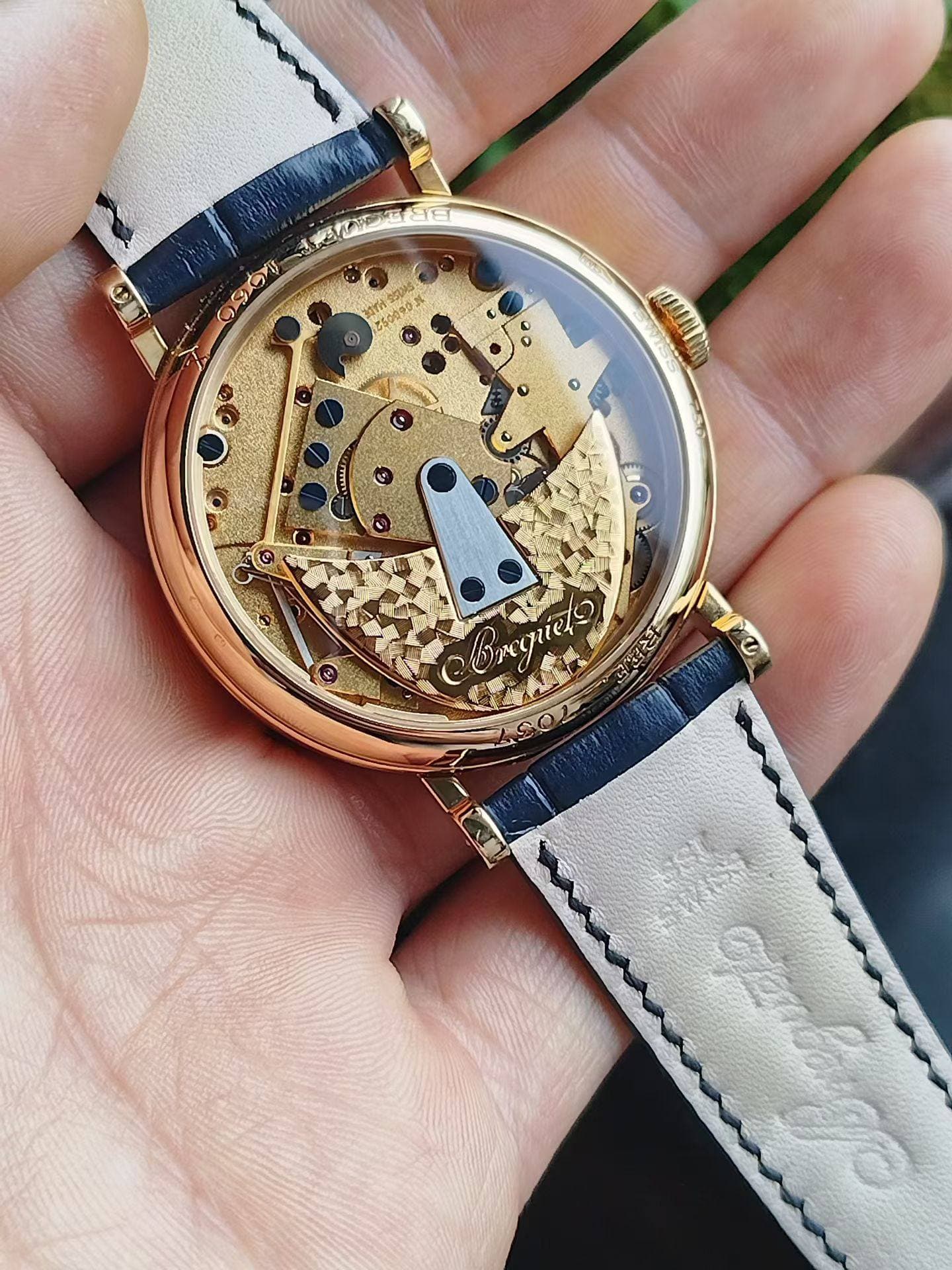 May be an image of wrist watch and text