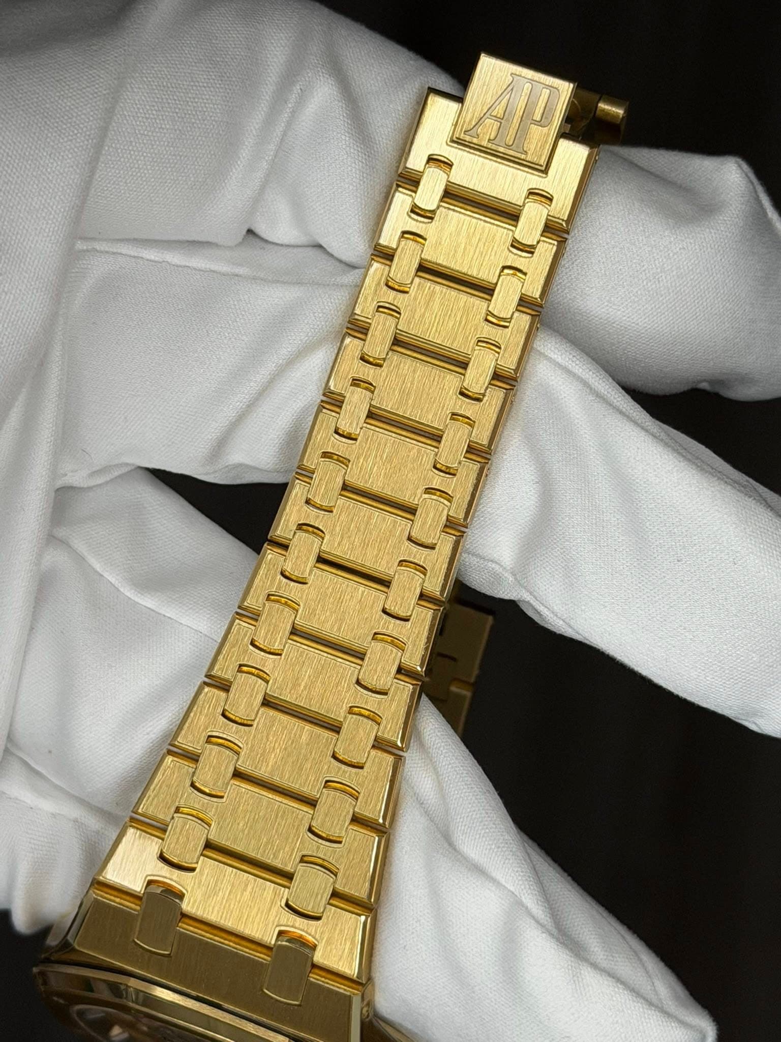 May be an image of wrist watch and text that says 'AT'
