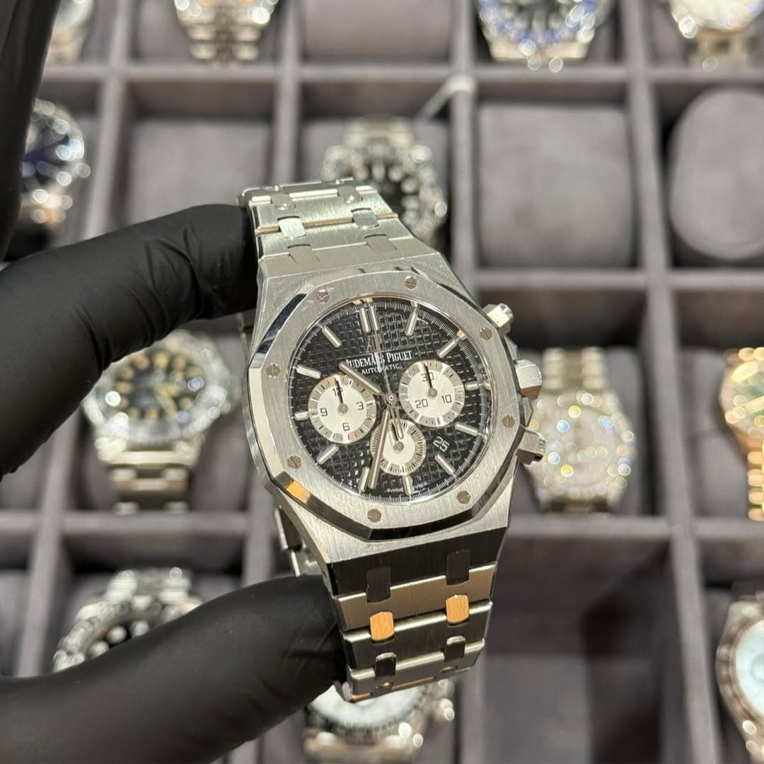 May be an image of wrist watch and text