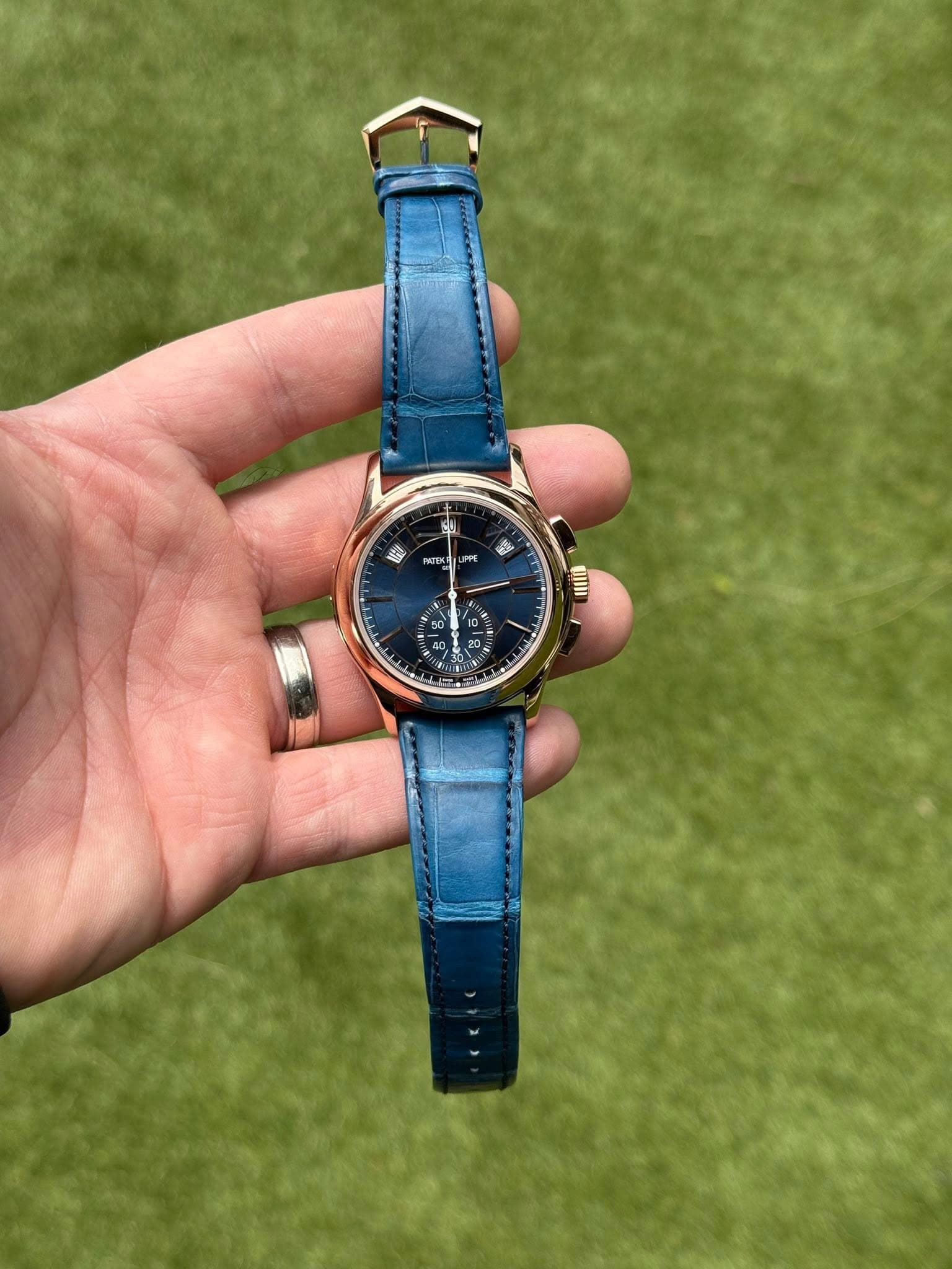 May be an image of wrist watch and text