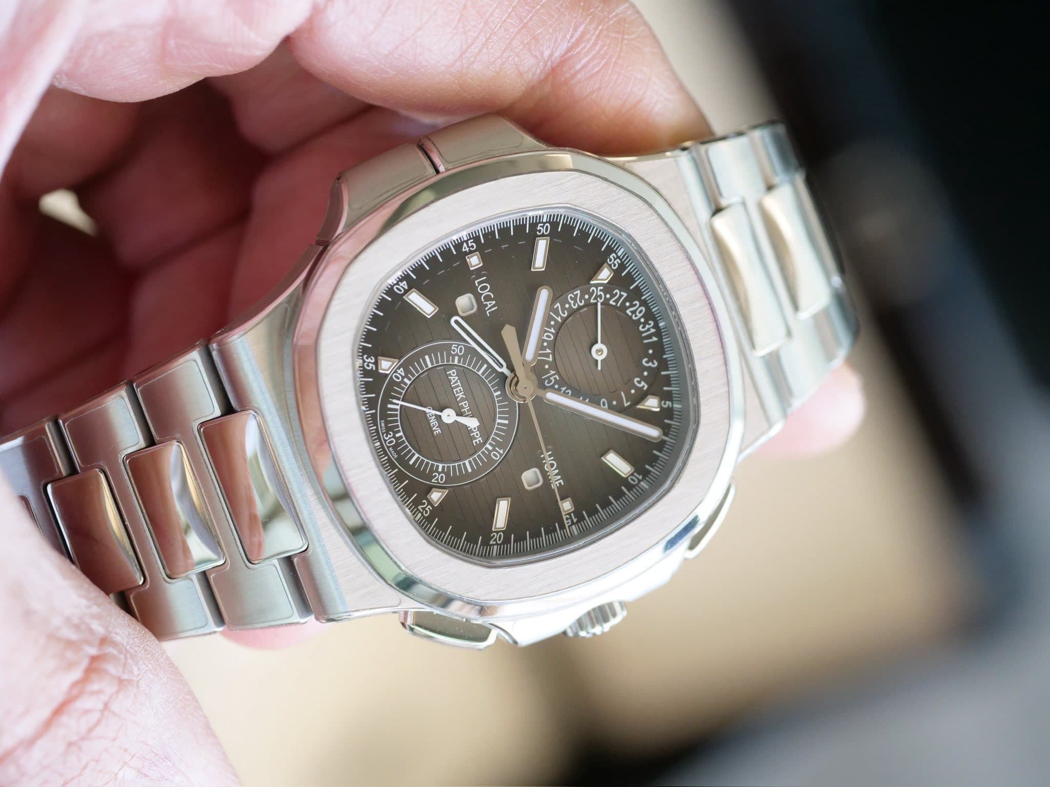 May be an image of wrist watch and text that says '50 0 upu 00 LOCAL CE OP دع ن فى 55 50 PATEKP JABNG ي بهيلا OPE 6 CZ HOME B'