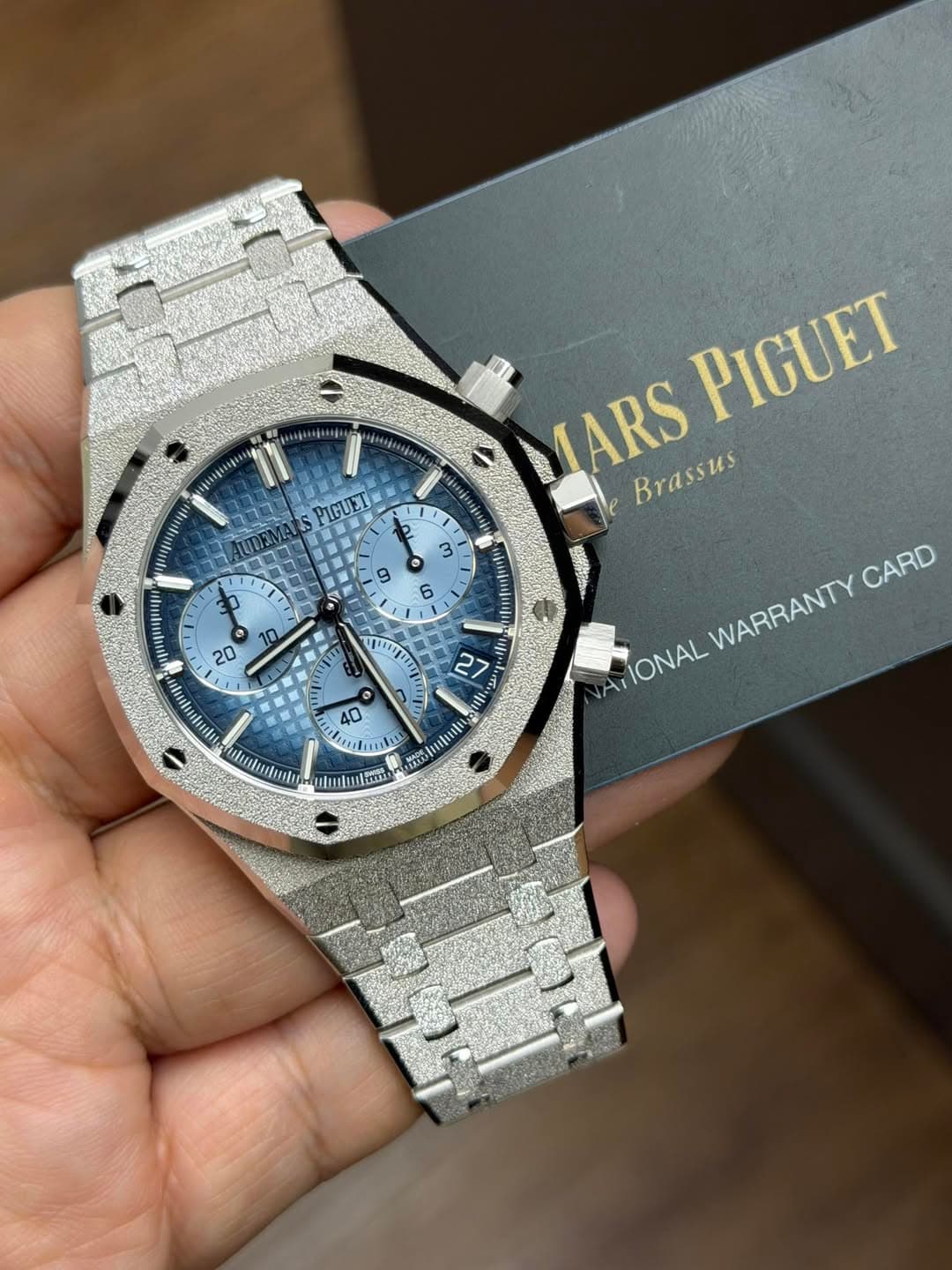 May be an image of wrist watch and text