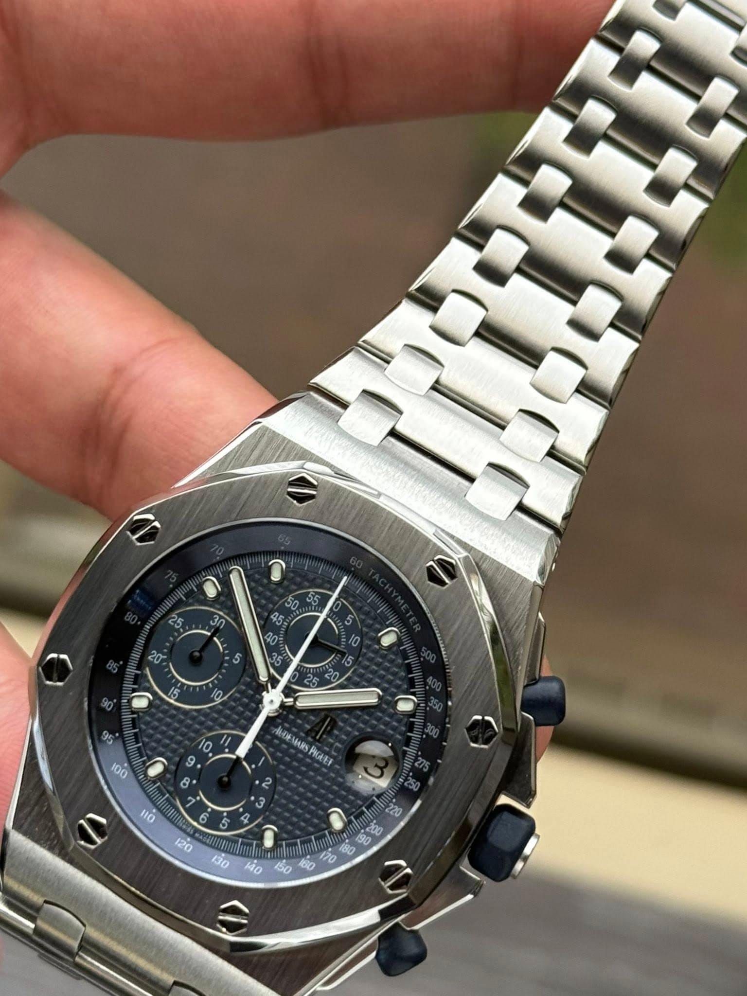 May be an image of wrist watch and text