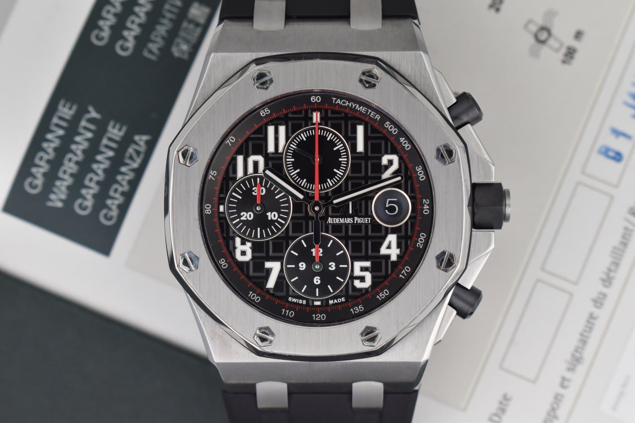 May be an image of wrist watch and text that says 'GAR GARA 60 65 nun II TACHYMET ME CHYME TER In 30 lm NIm 80 GARANTIE WARRANTY GARANTIE GARANZIA 20 10 AUDEMARS PIGUET ងី ម A 7…