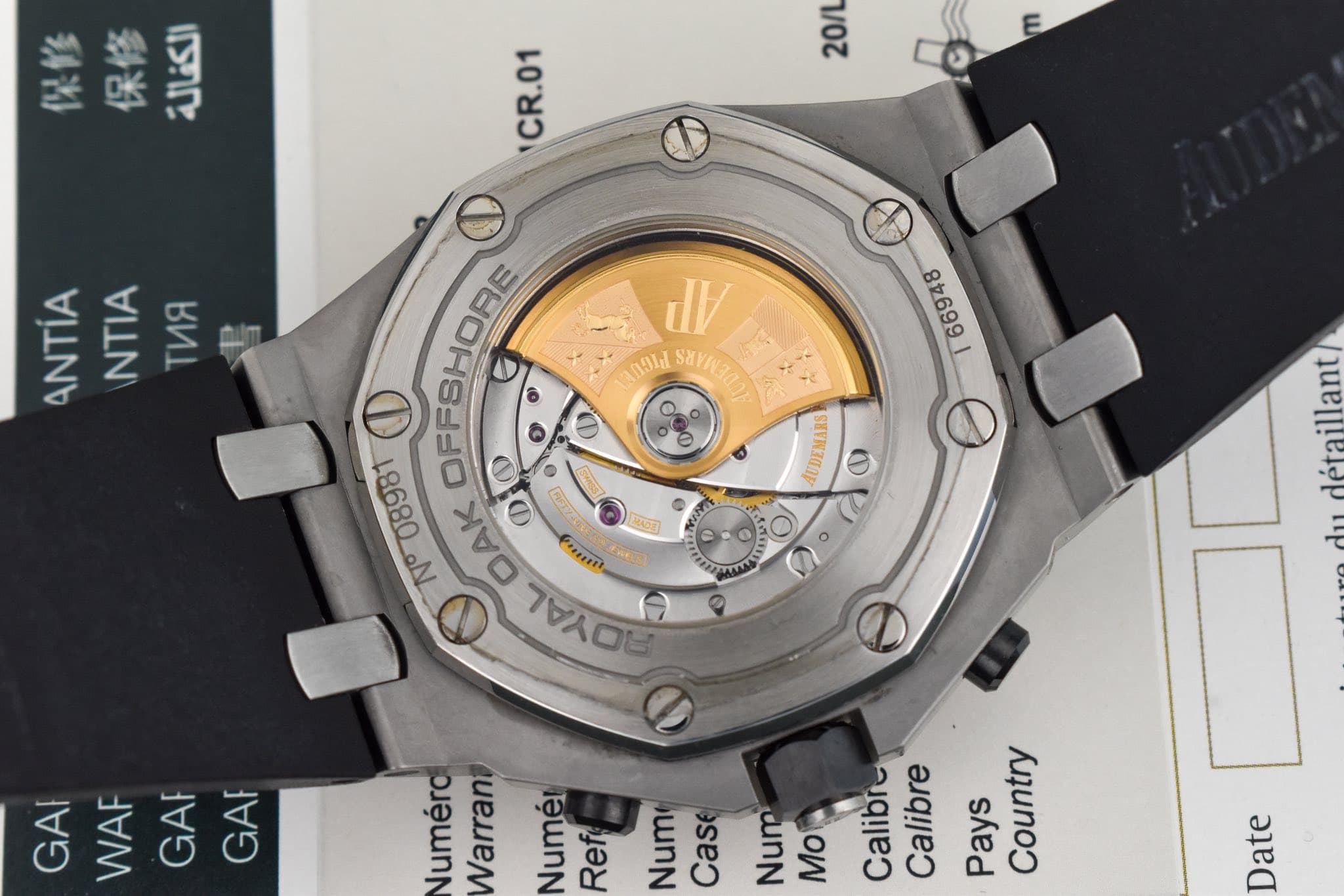 May be an image of wrist watch and text that says '保修 保修 الكفالة 20/L E CR.01 ANTIA NTIA TИR JV Fgldd SaYR3 SaYA 8699 D EFSHORE OFFSHOS 0 08981 کل DAK Ф 司 בה a표 Ponesh Tweh 7OE…
