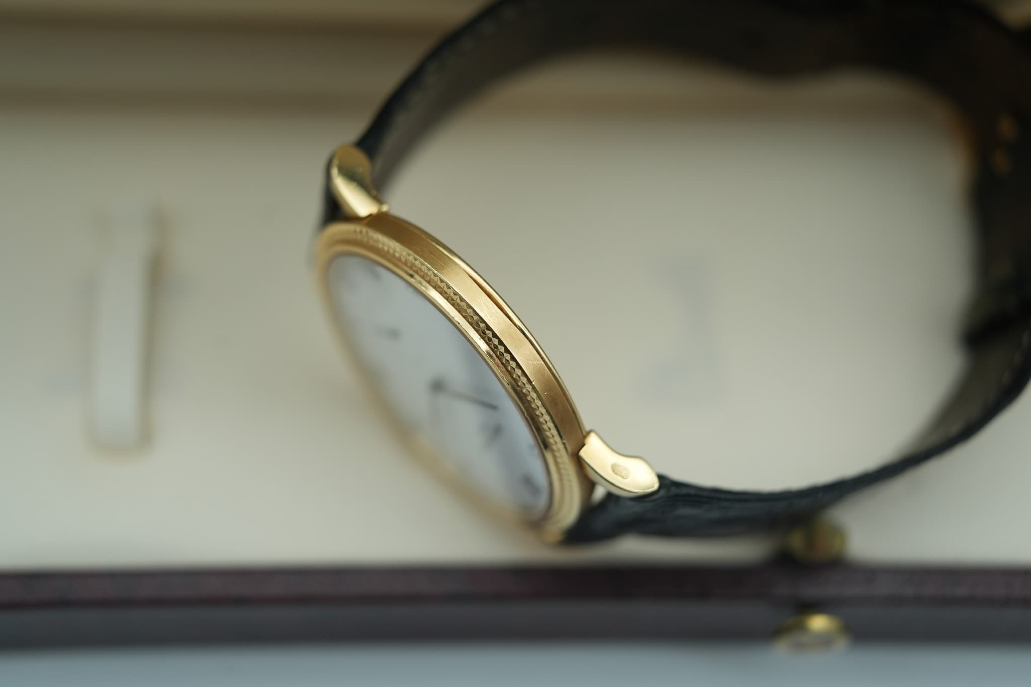 May be an image of wrist watch and text
