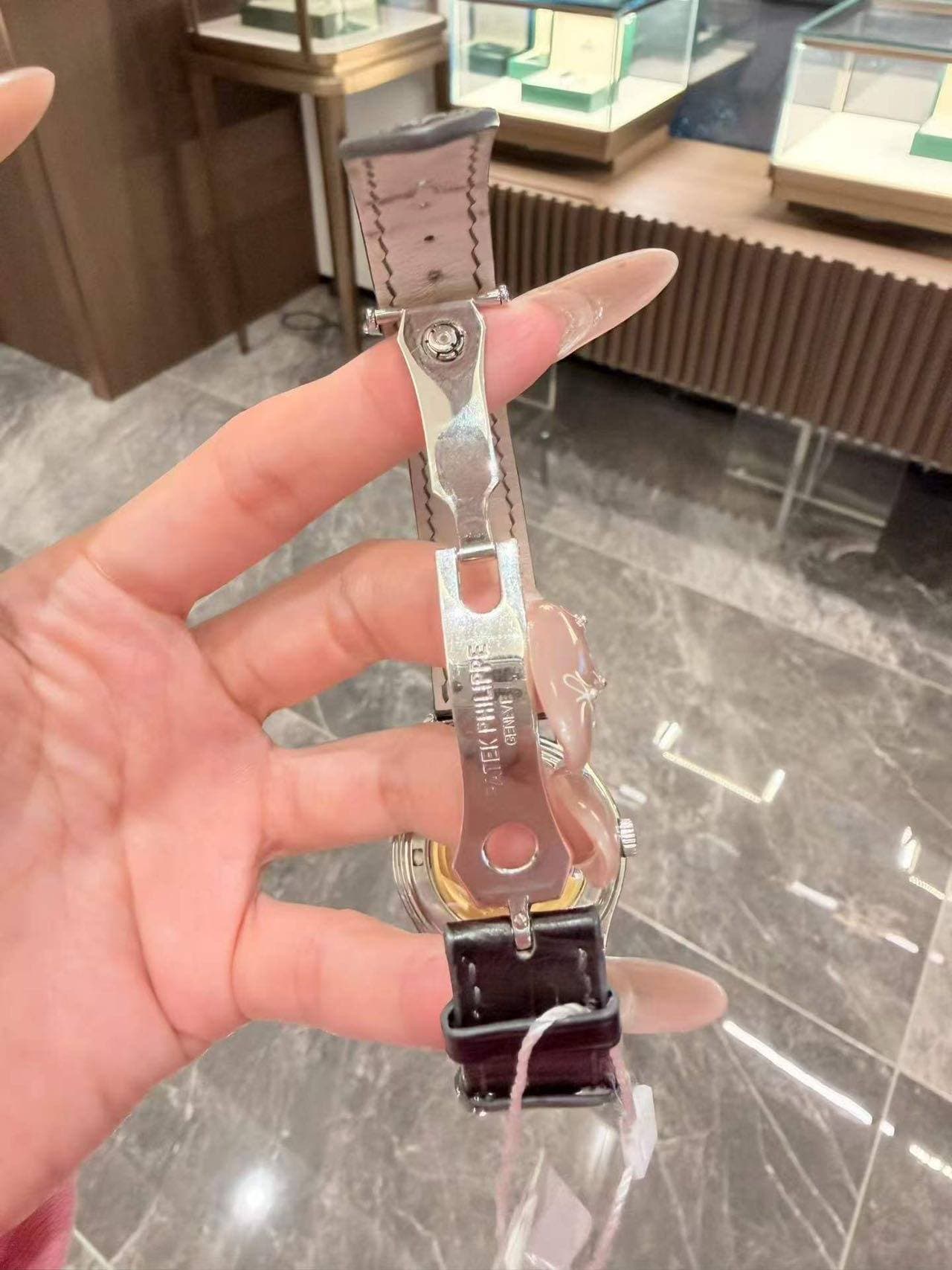 May be an image of wrist watch