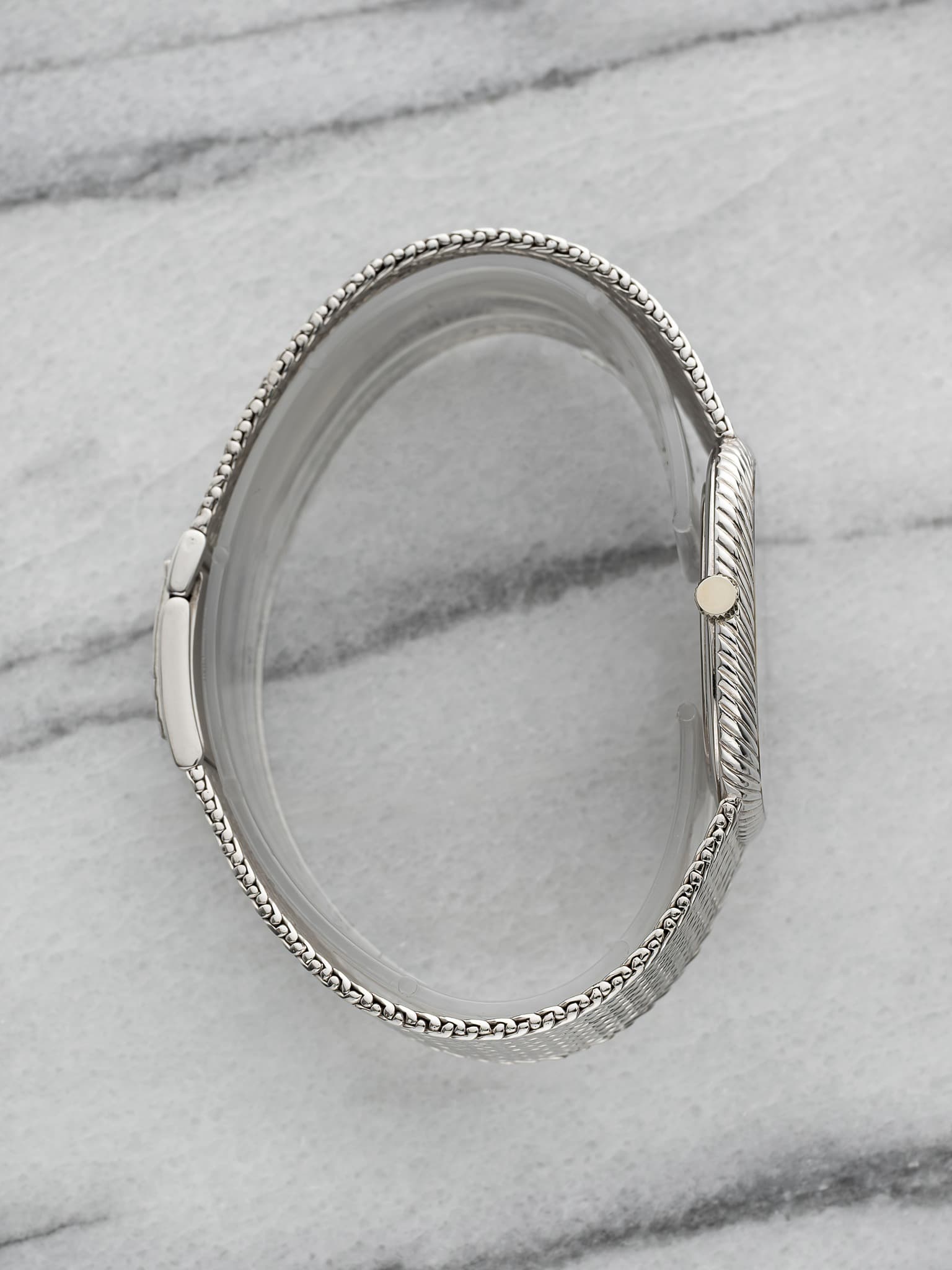 May be an image of jewelry and wrist watch
