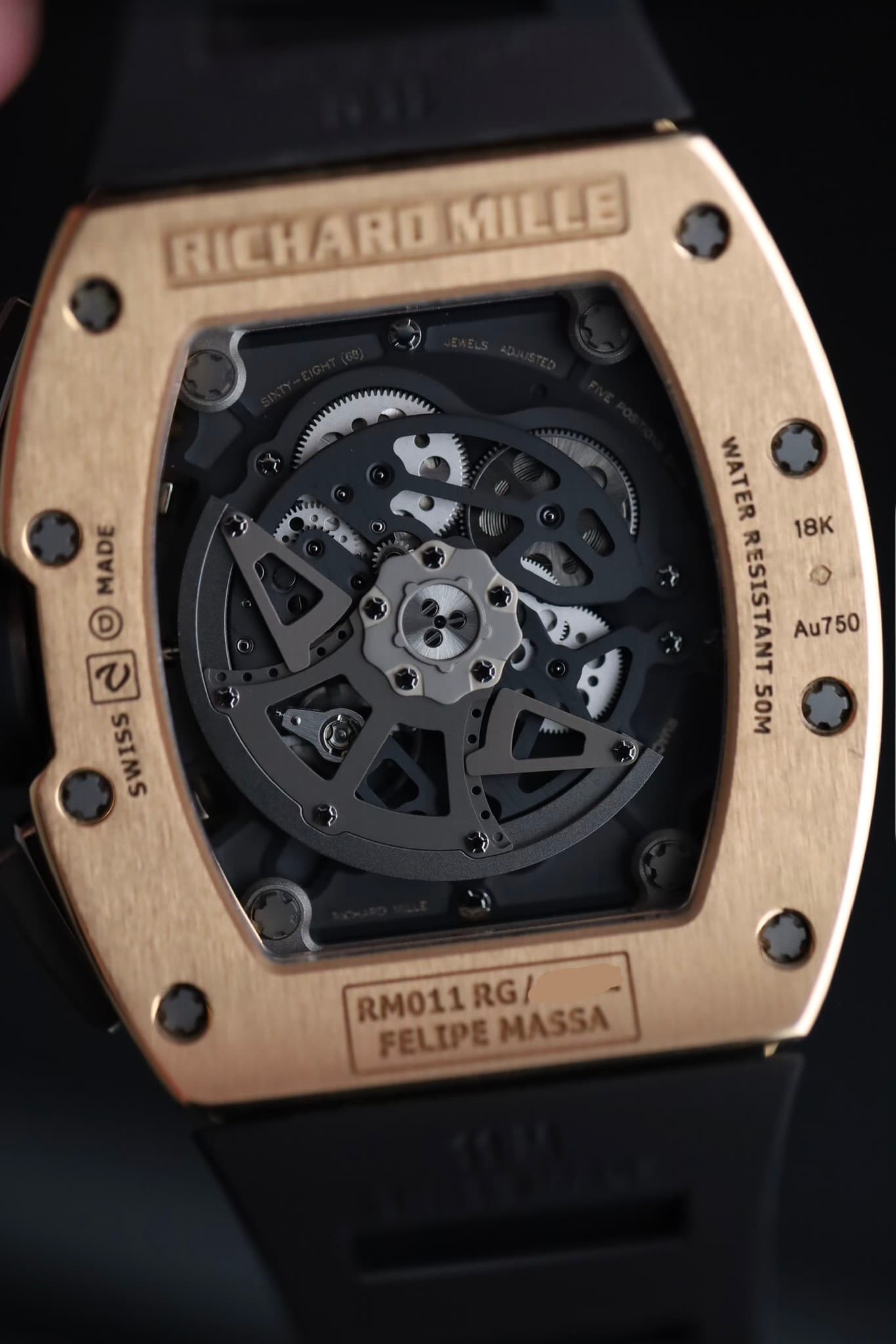May be an image of wrist watch and text that says 'RICHARI RICHAROM MILLE olo 3 س MADE 2 © C SSIMS WATER RESISTANT Au750 18K 50M ن RM011RG/ RPELEPEMASSA RM011 FELIPEMASSA FELIPE…