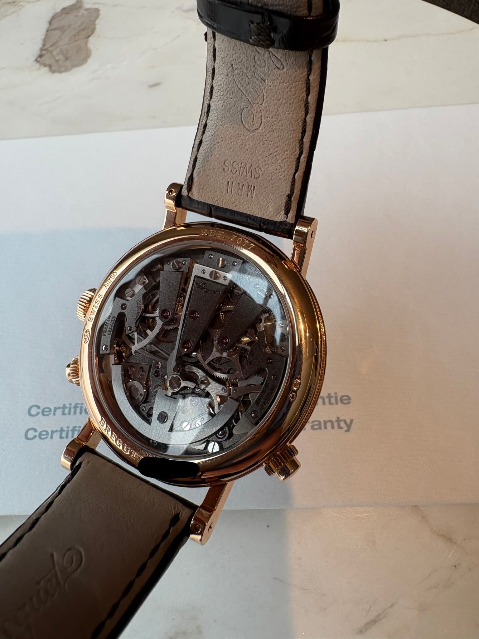 May be an image of wrist watch and text