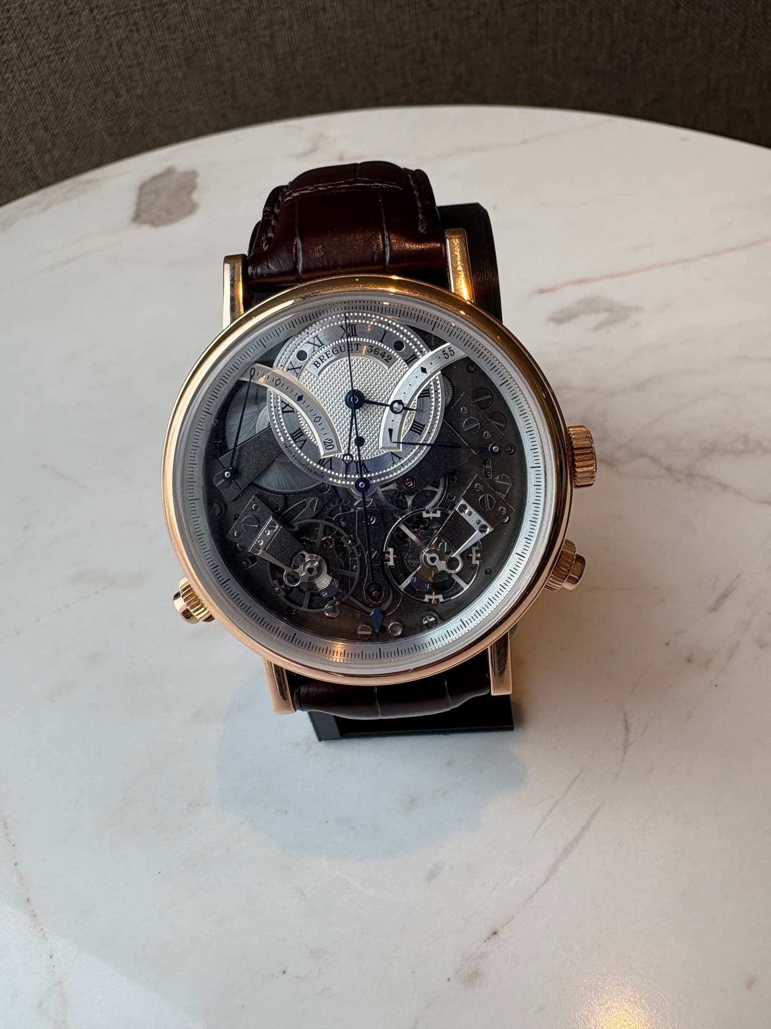 May be an image of wrist watch and text