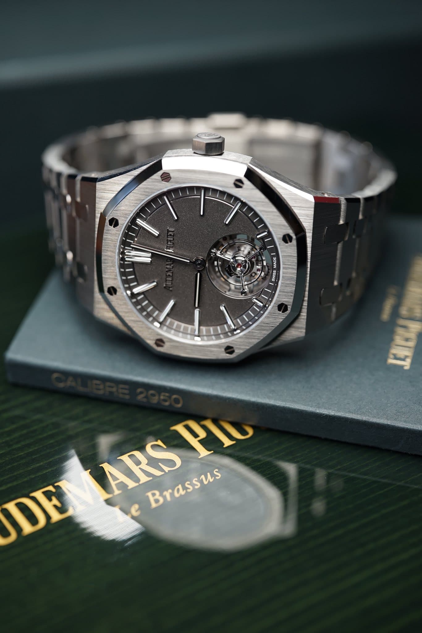 May be an image of wrist watch and text that says 'OV SONG E HIBN TARS Brassus Brassus Plu DE e'