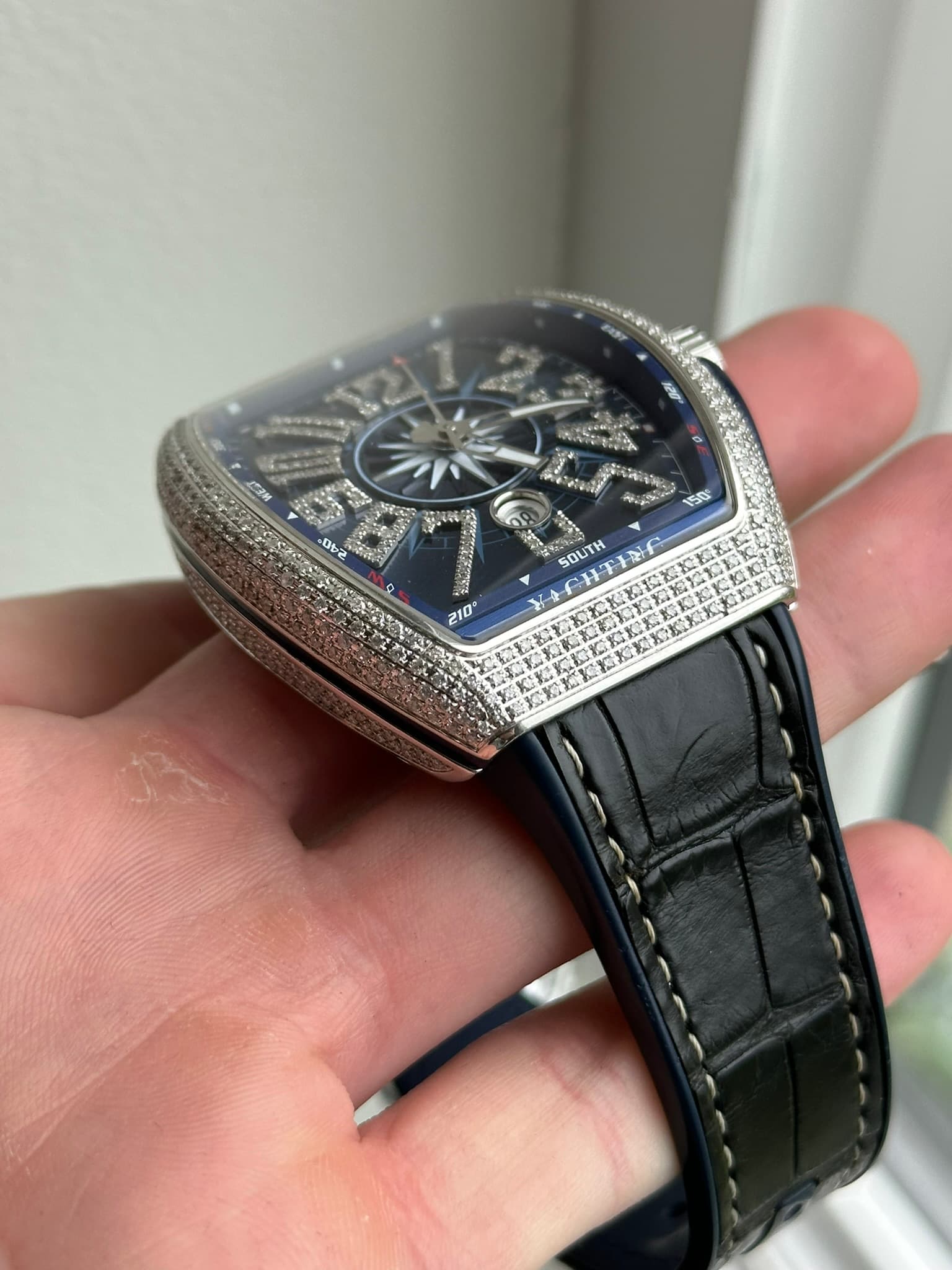 May be an image of wrist watch and text