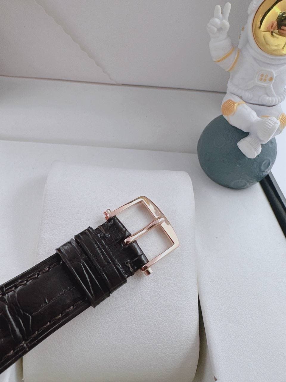 May be an image of saddle-stitched leather and wrist watch