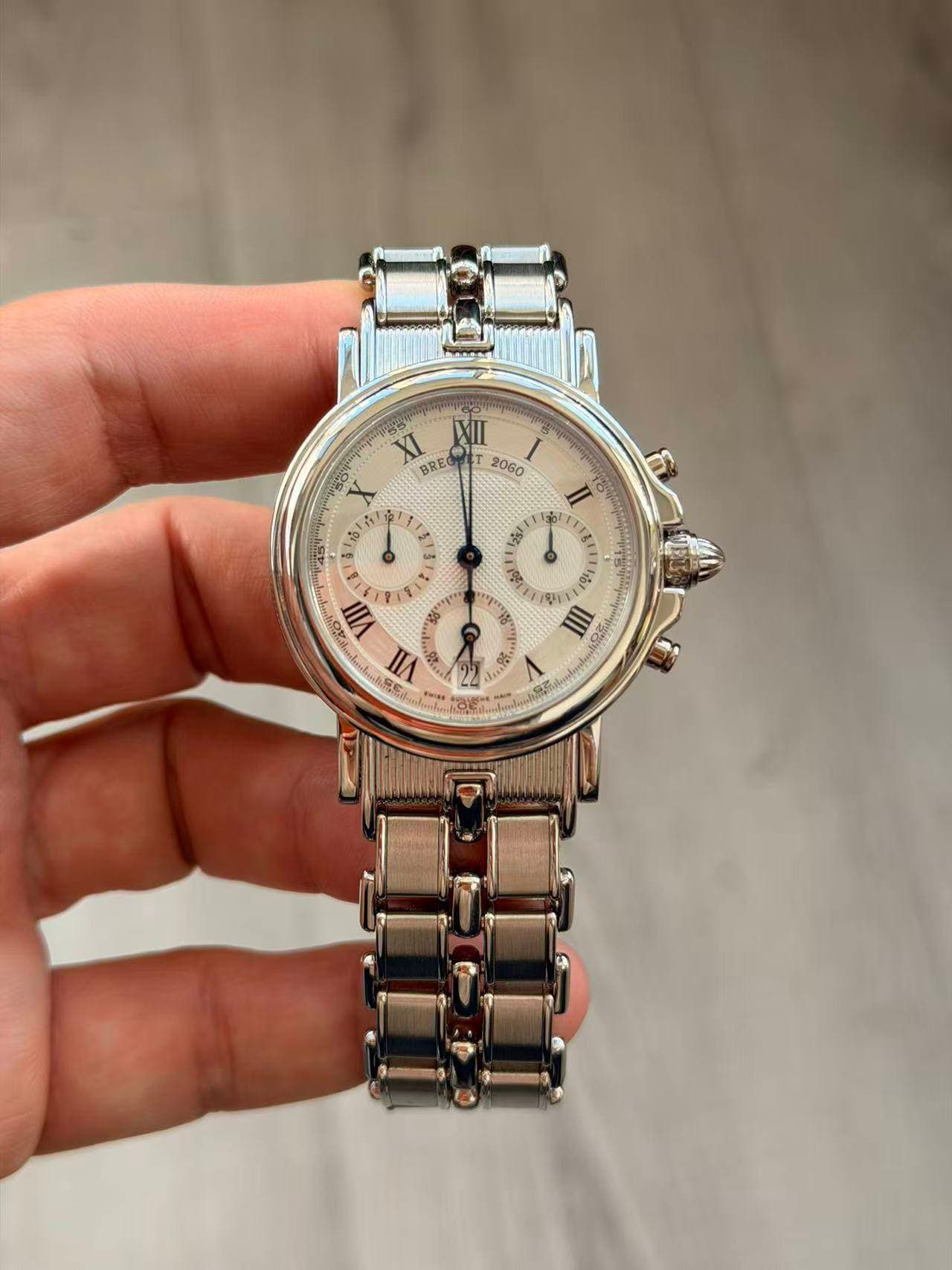 May be an image of wrist watch and text