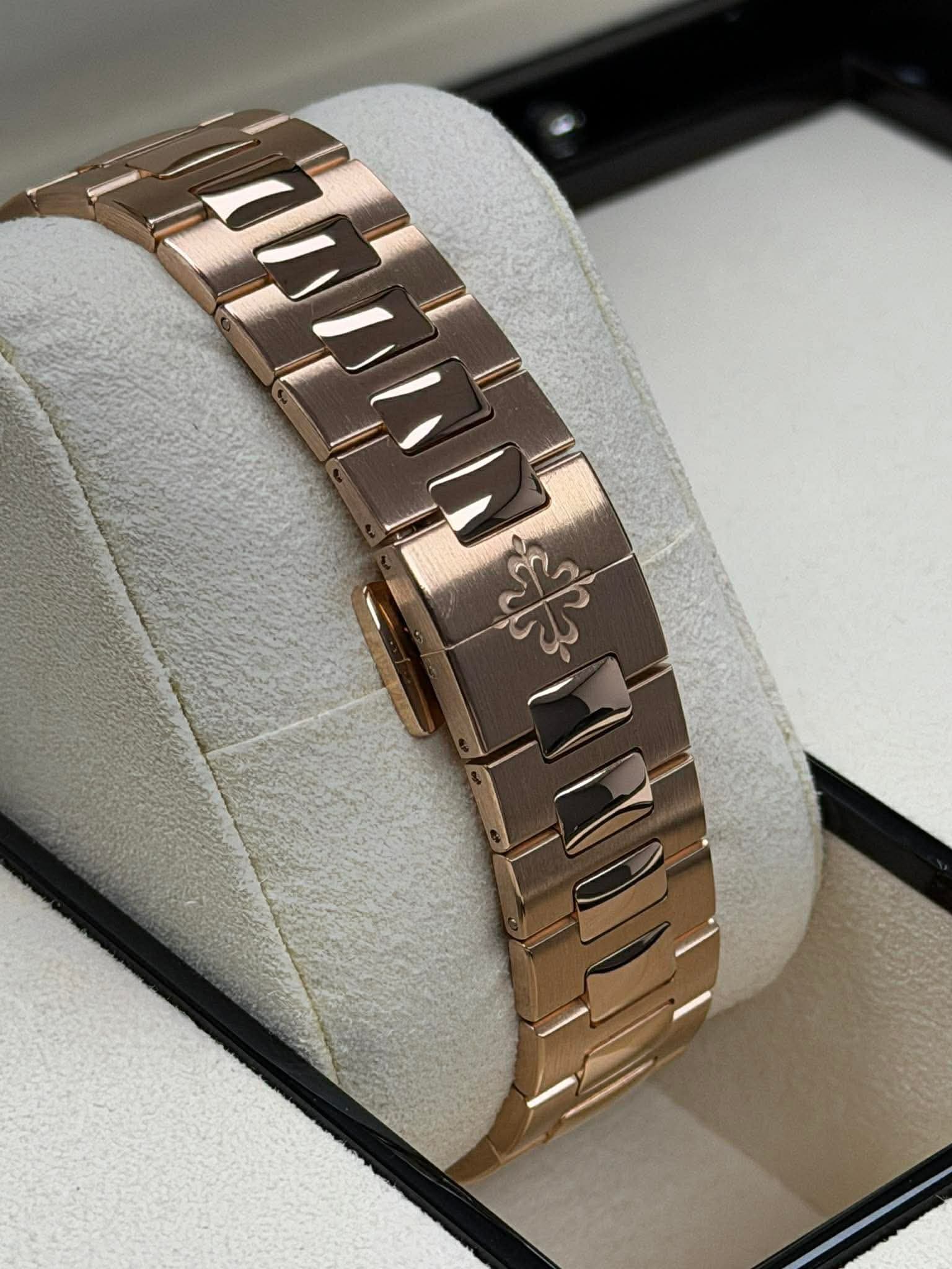 May be an image of wrist watch and jewelry