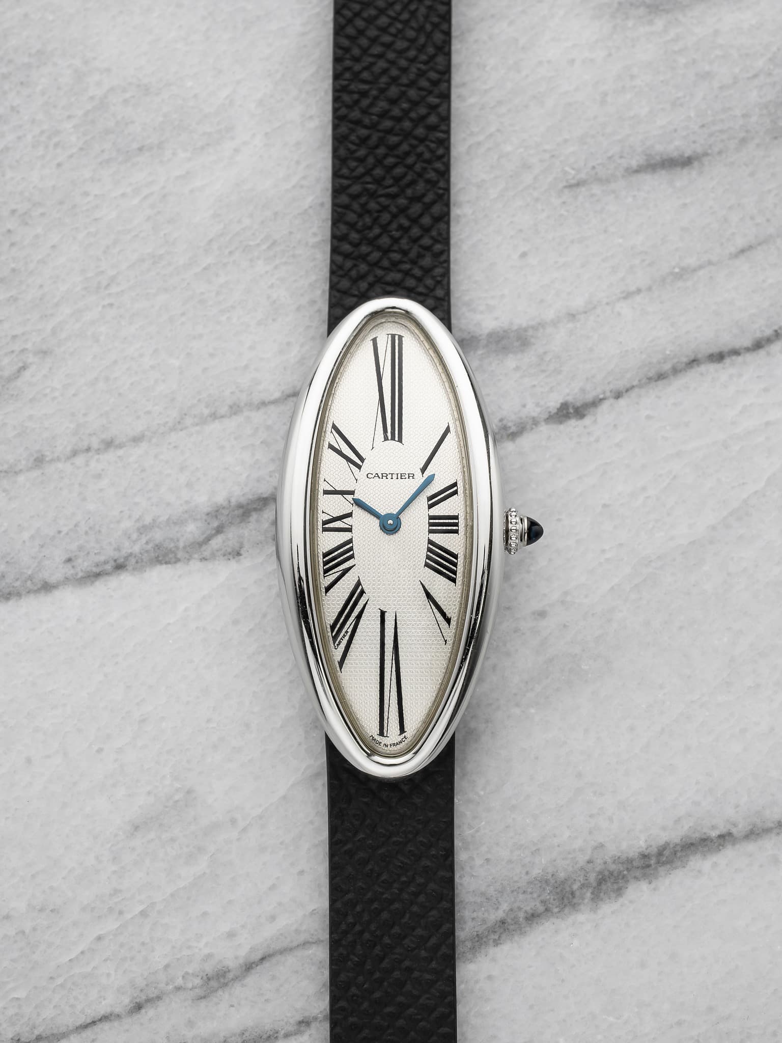May be an image of wrist watch, leather and text that says 'V CARTIER 1 ।।।'