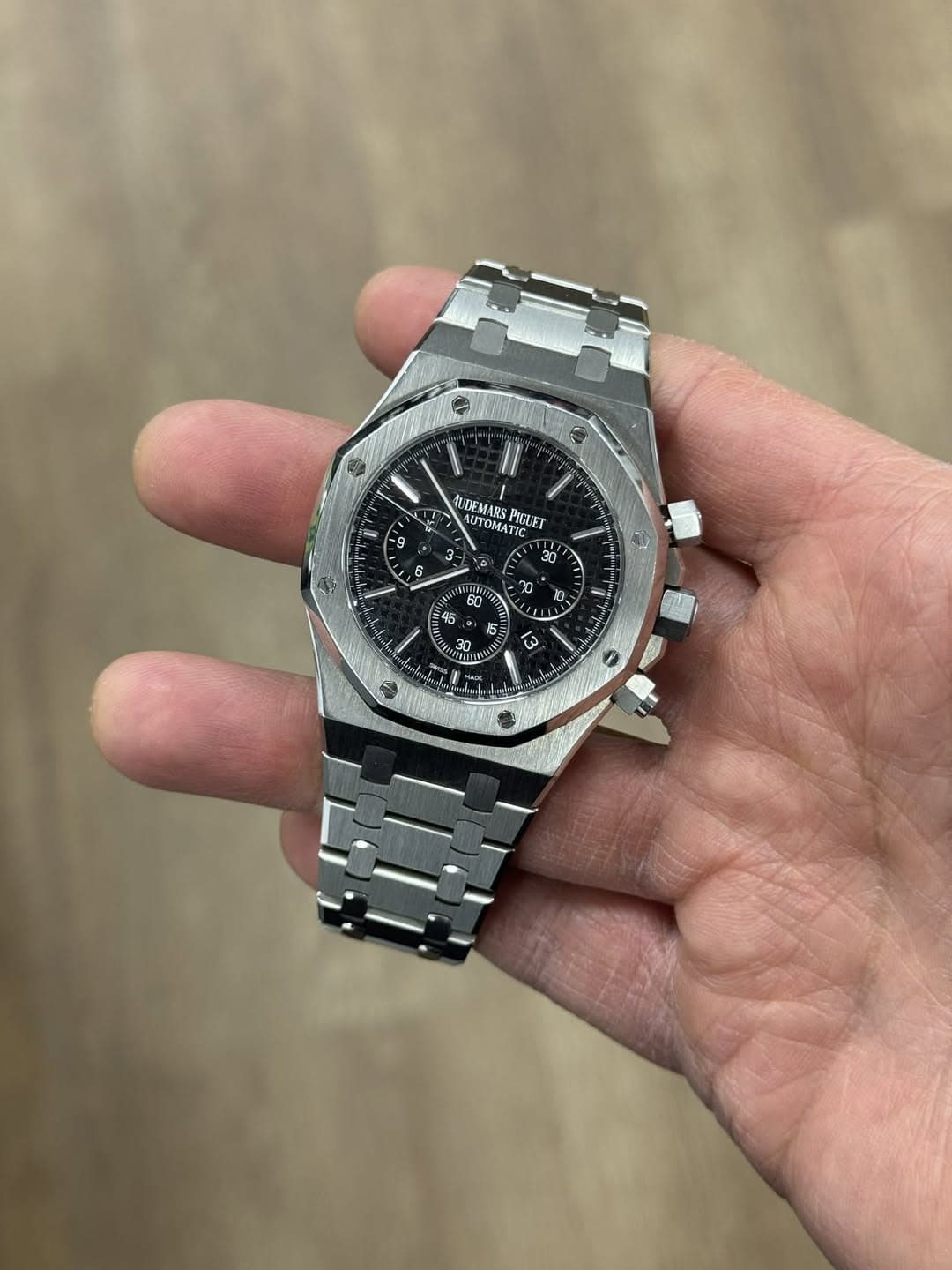 May be an image of wrist watch and text