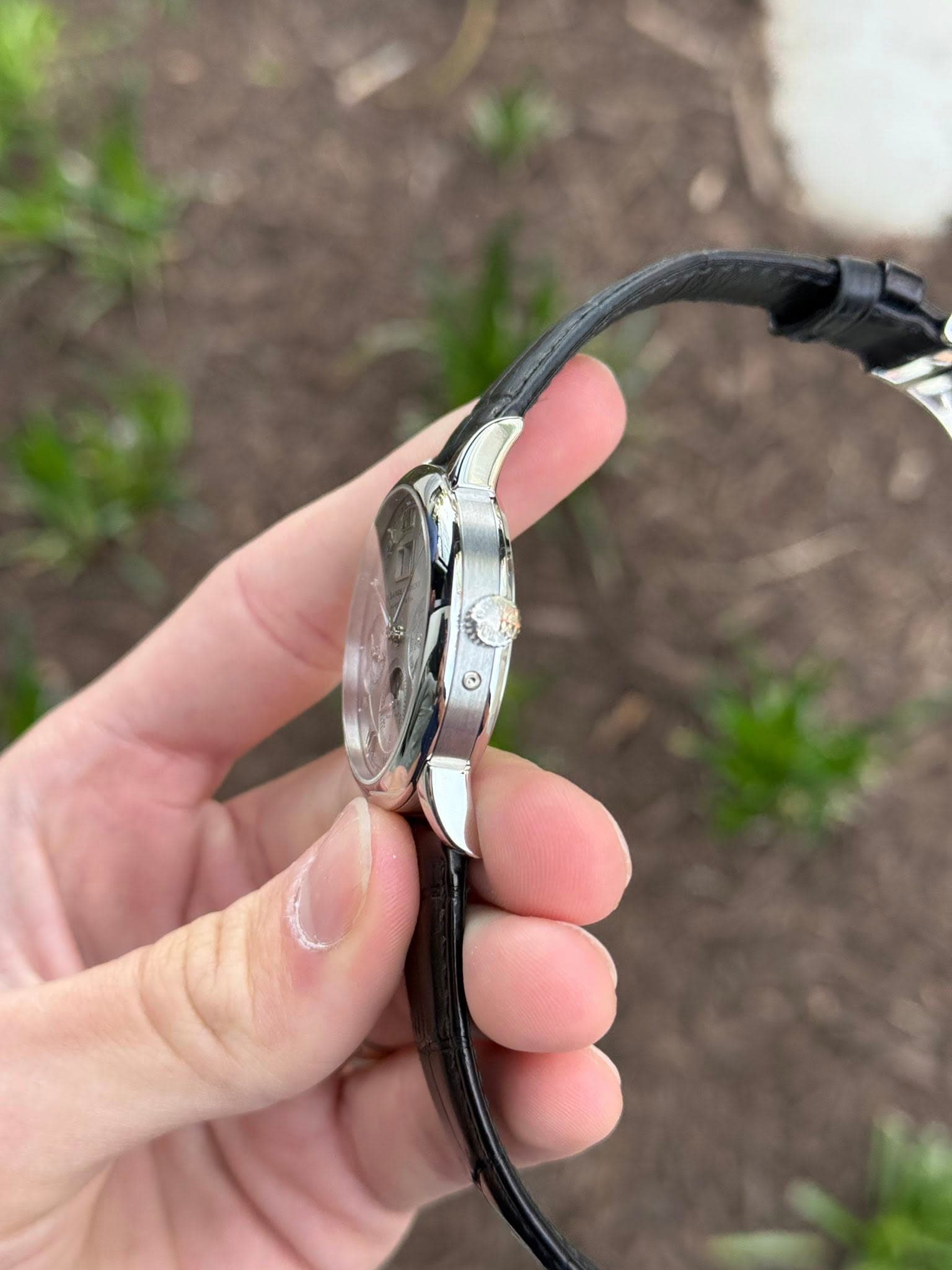 May be an image of digital watch and eyeglasses