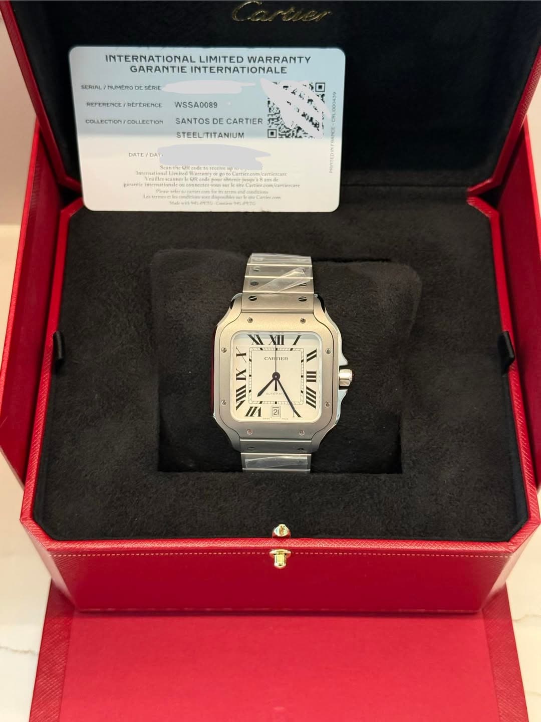 May be an image of digital watch and text that says 'SERIAL TLMERODI INTERNATIONAL LIMITED WARRANTY GARANTIE GARANTIEINTERNATIONALE INTERNATIONALE SERE RETERENCE…