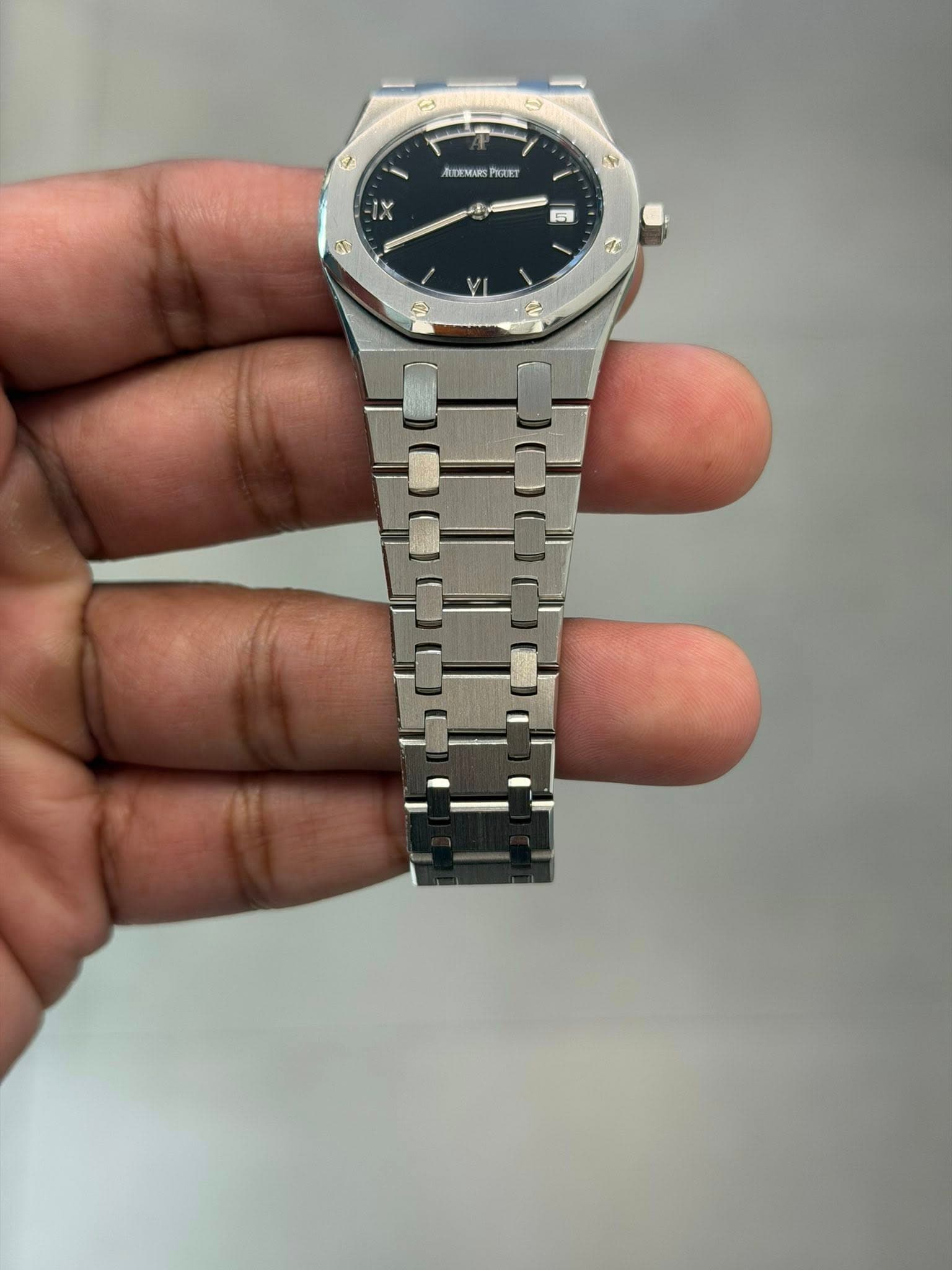May be an image of wrist watch and text