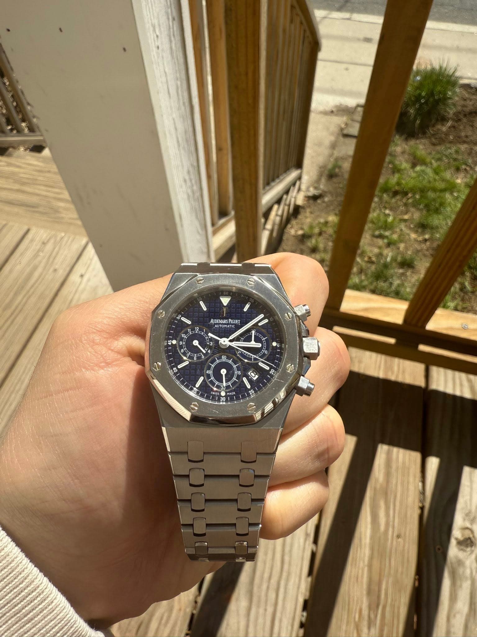 May be an image of wrist watch and text