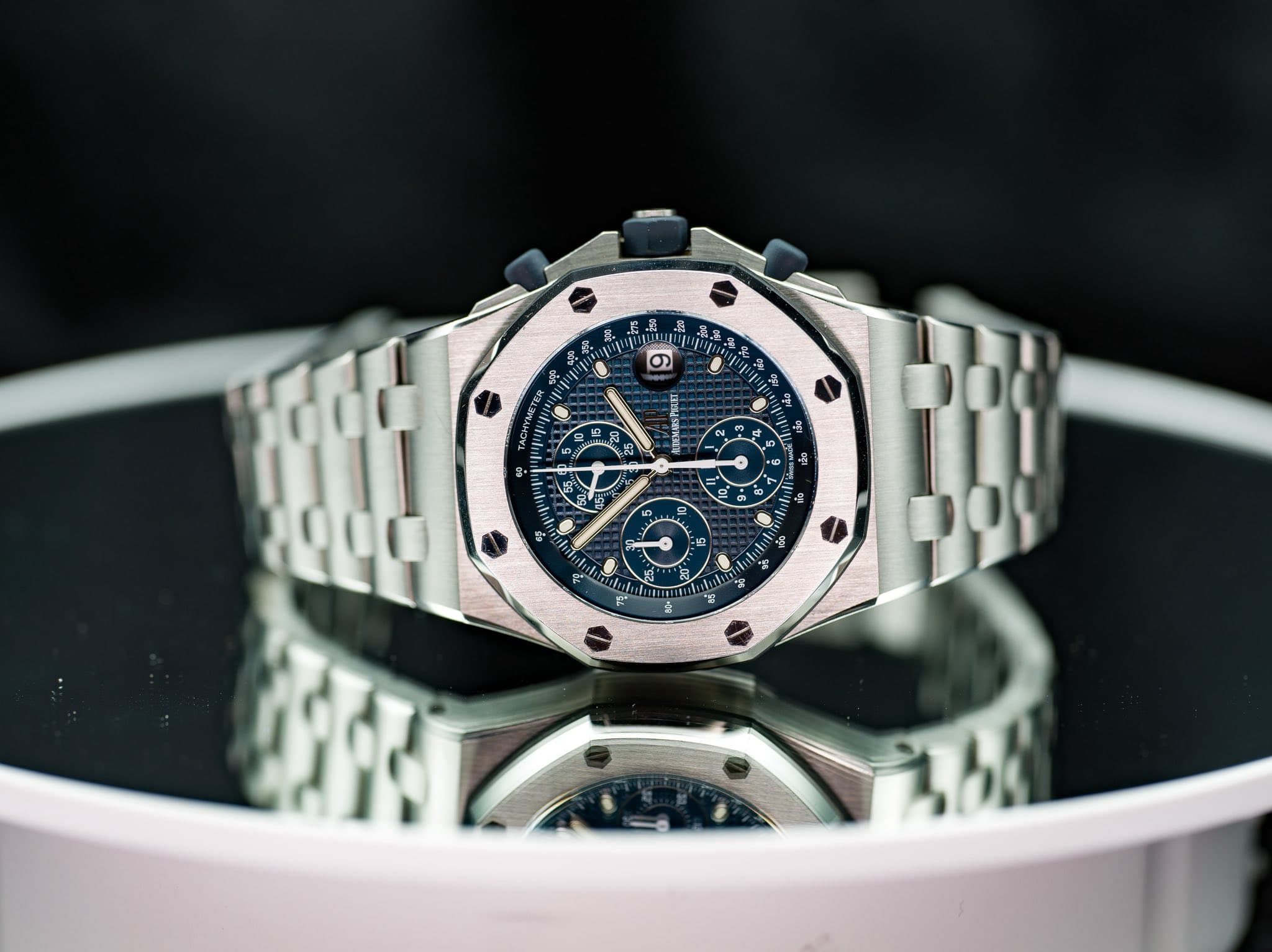 May be an image of wrist watch and text