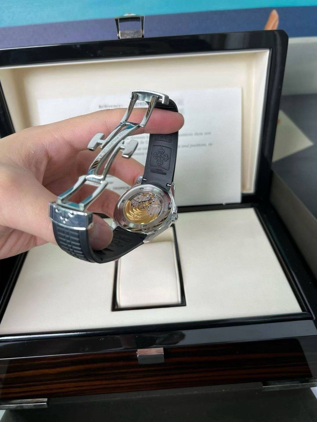 May be an image of wrist watch and text