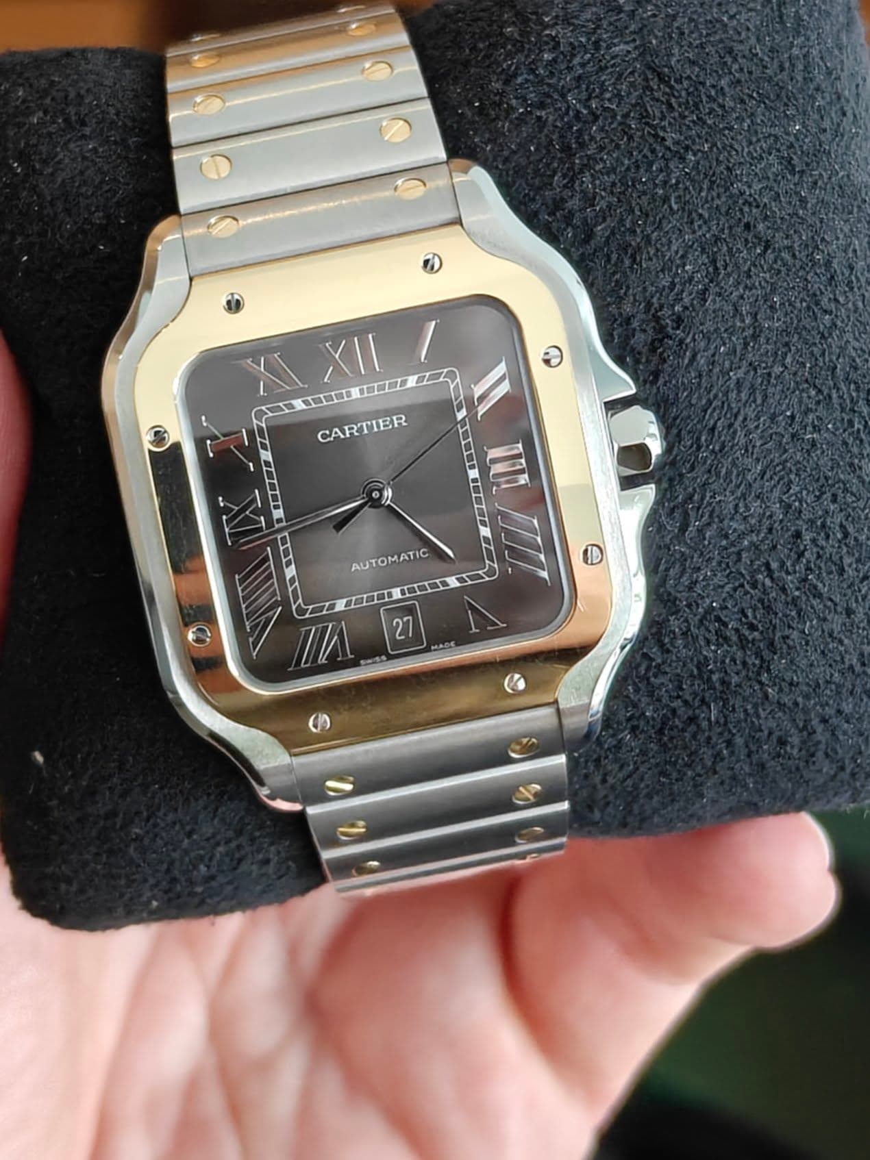 May be an image of wrist watch and text