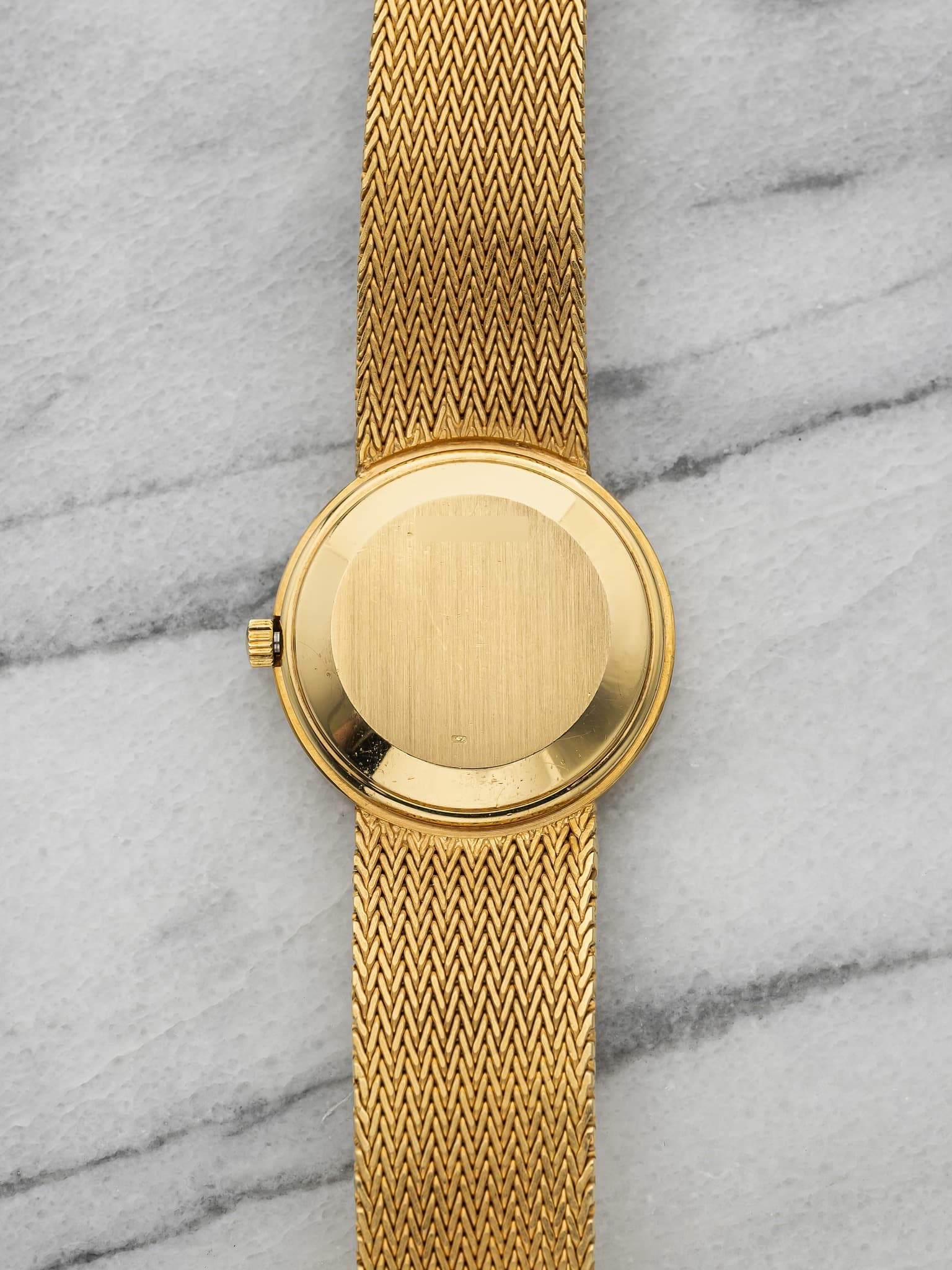 May be an image of wrist watch and jewelry