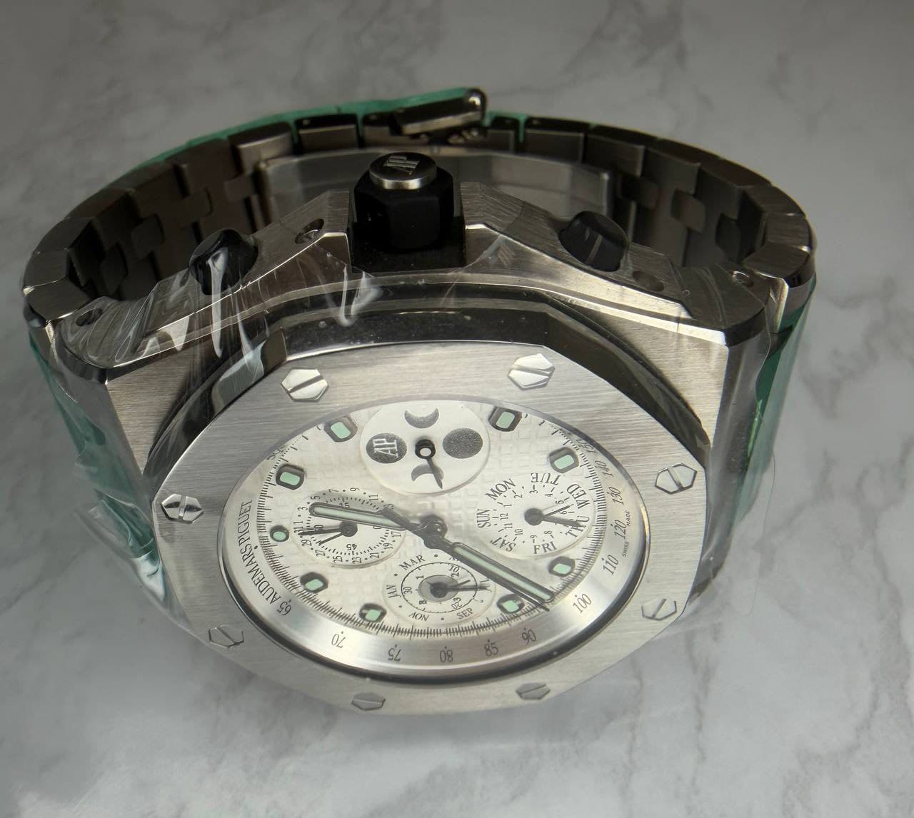 May be an image of wrist watch and text