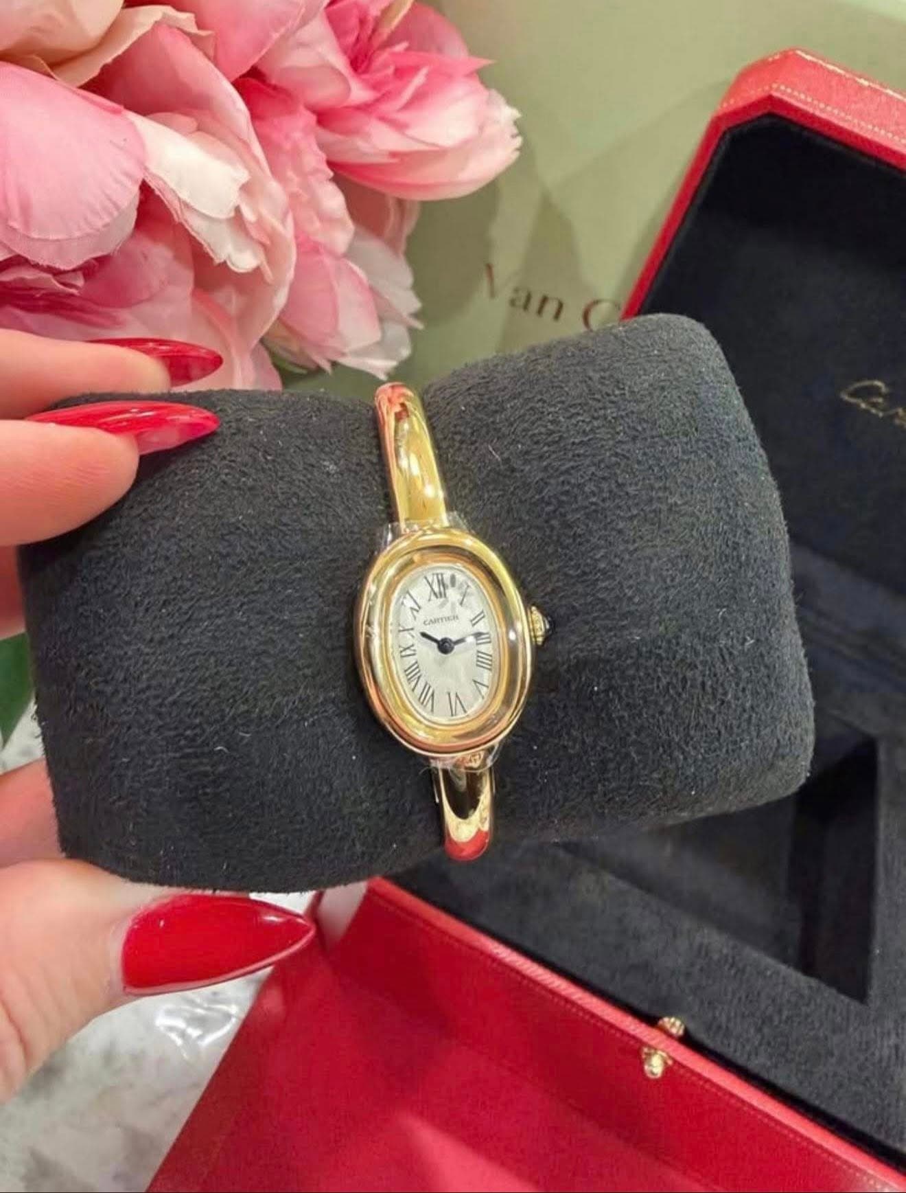 May be an image of wrist watch and text