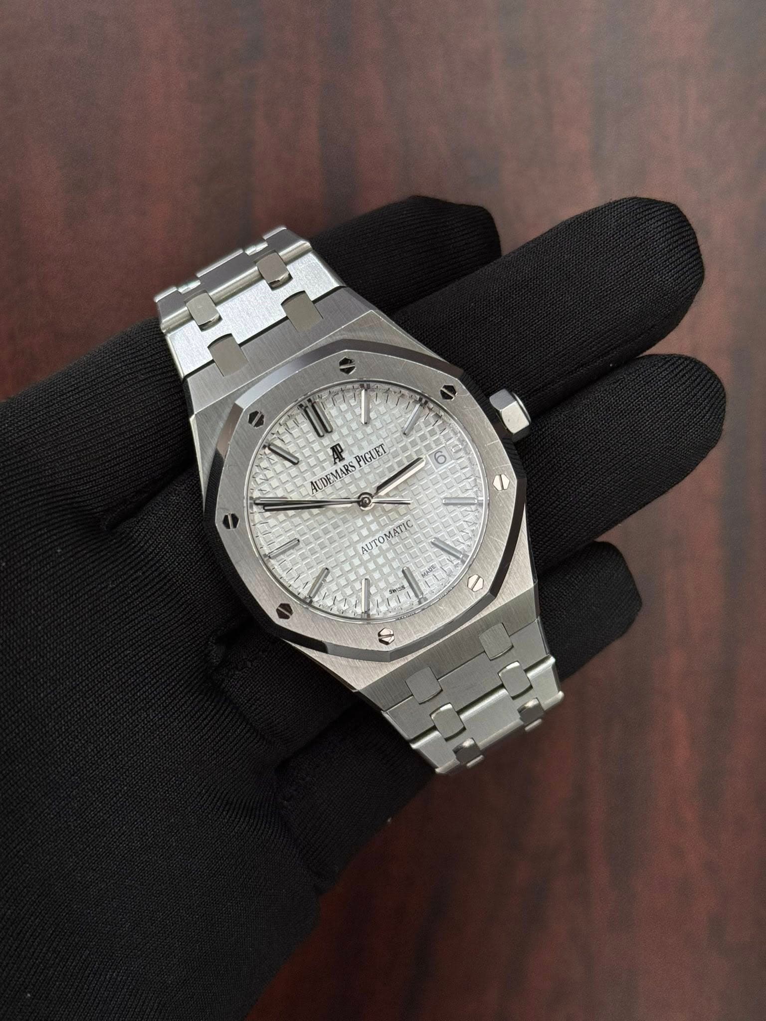 May be an image of wrist watch and text