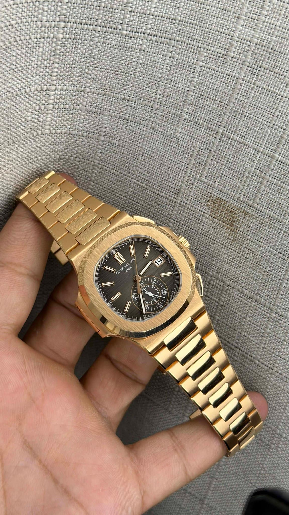 May be an image of wrist watch and text