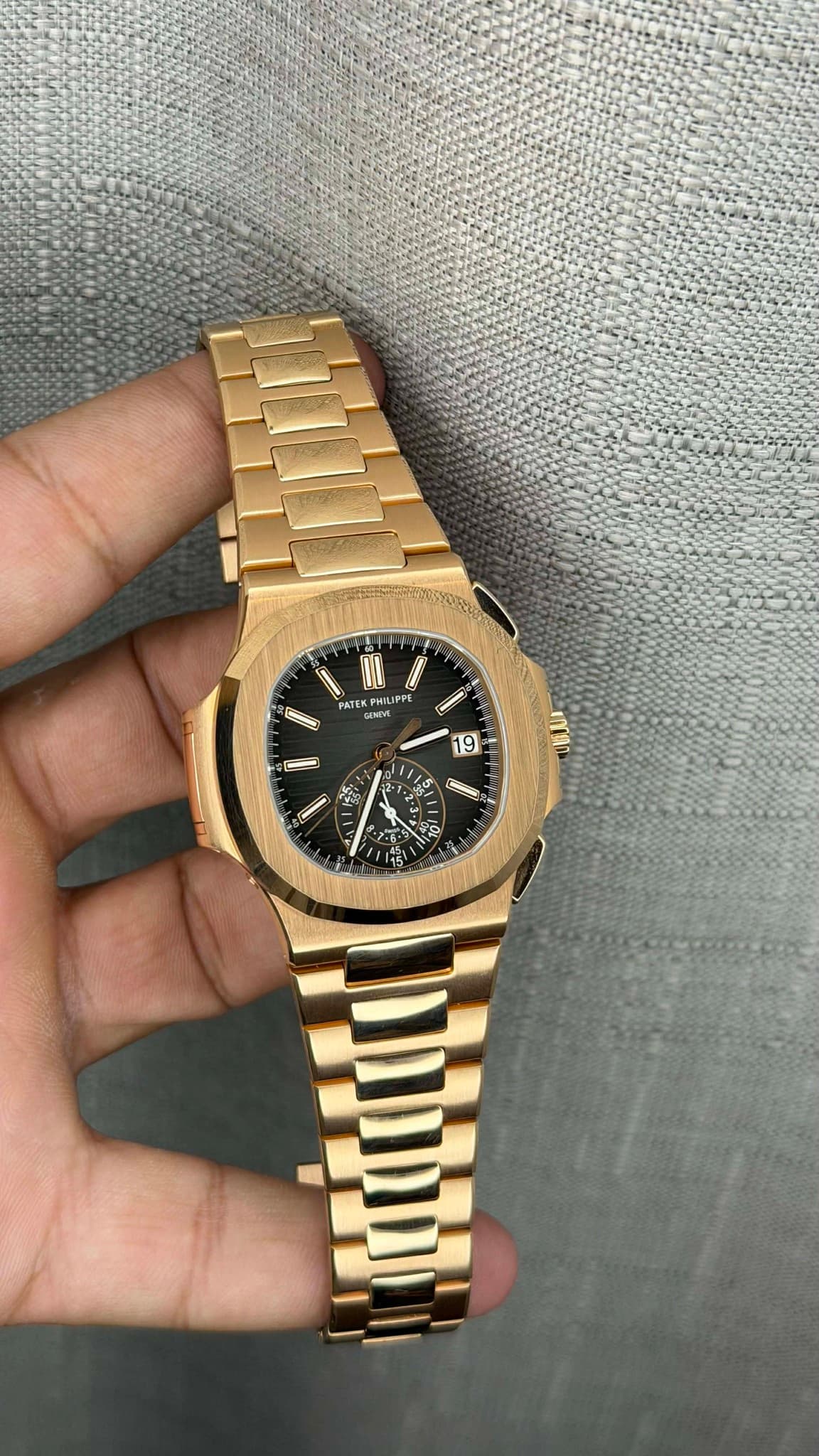 May be an image of wrist watch and text