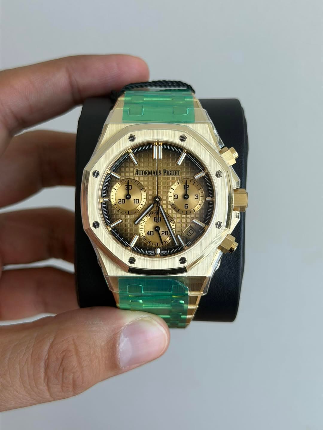 May be an image of wrist watch and text
