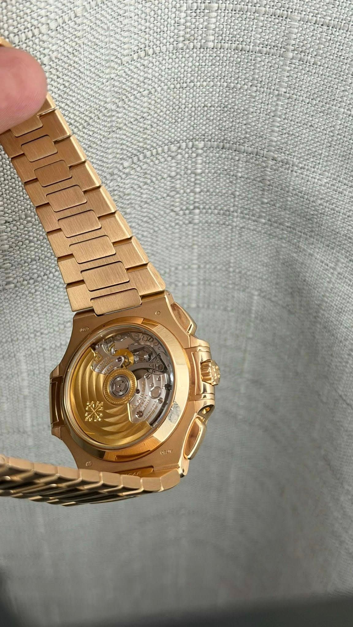 May be an image of wrist watch and text