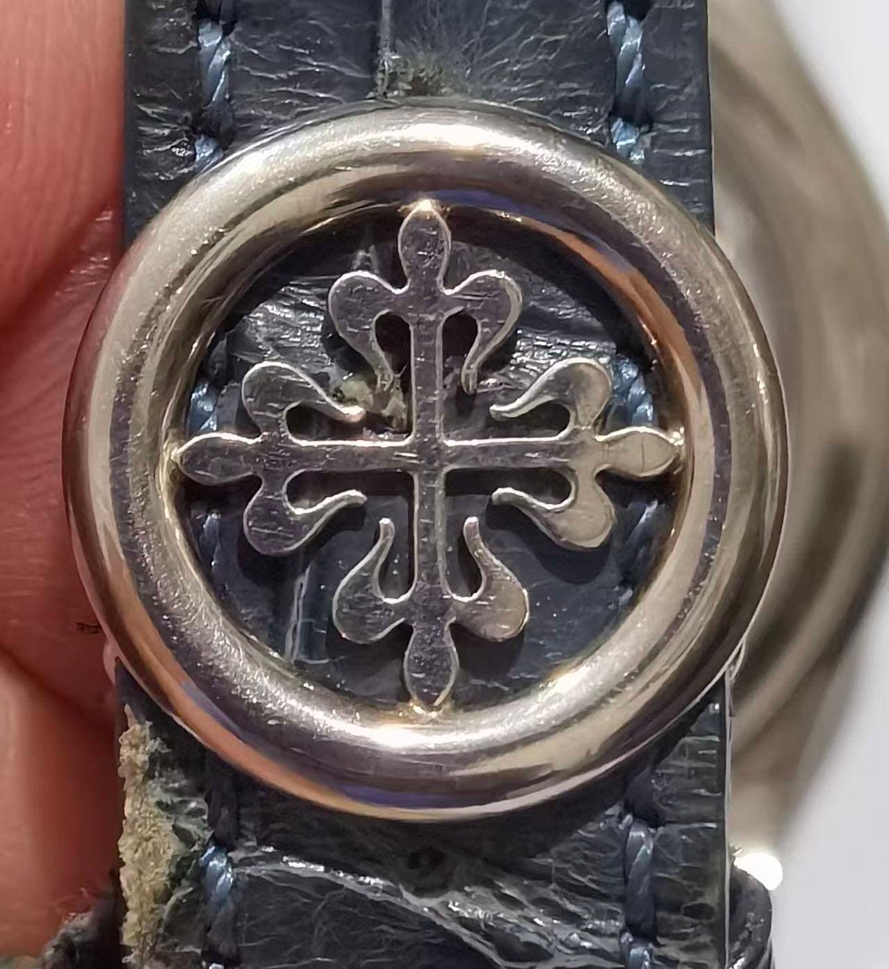 May be an image of wrist watch and leather