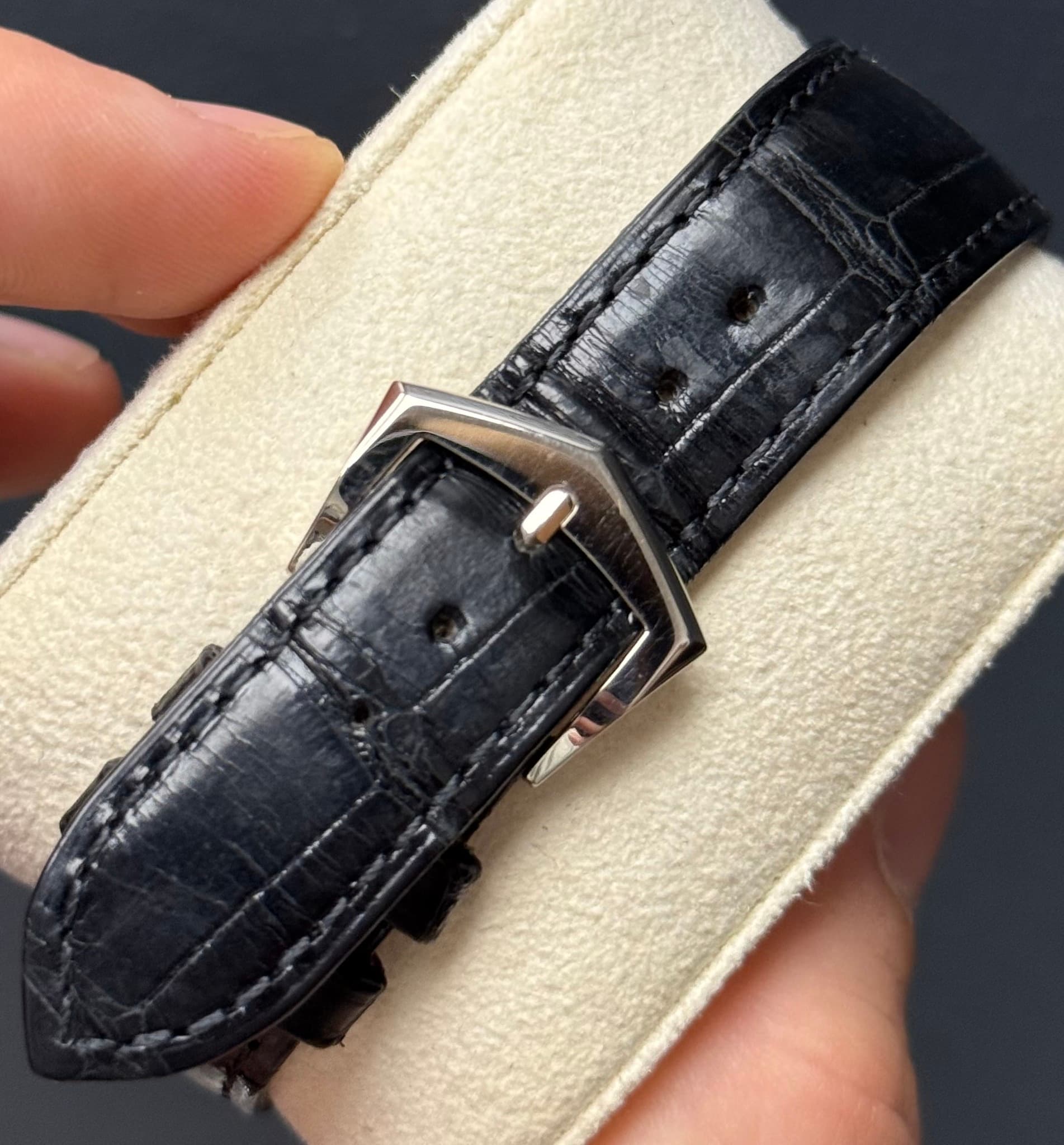 May be an image of leather, wrist watch and saddle-stitched leather