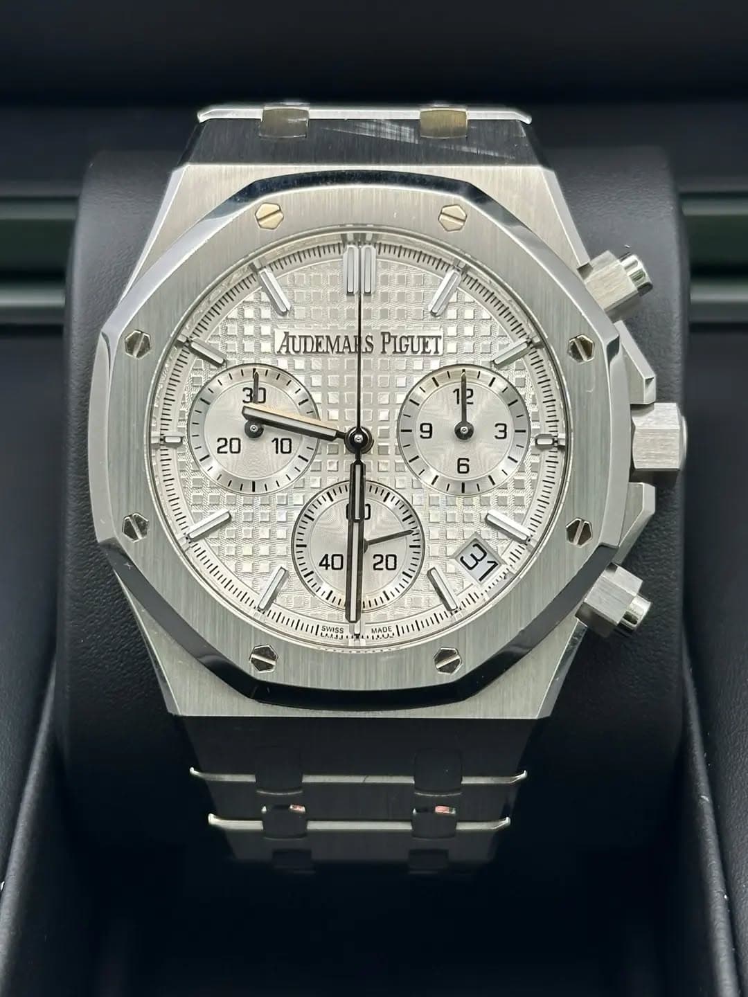 May be an image of wrist watch and text