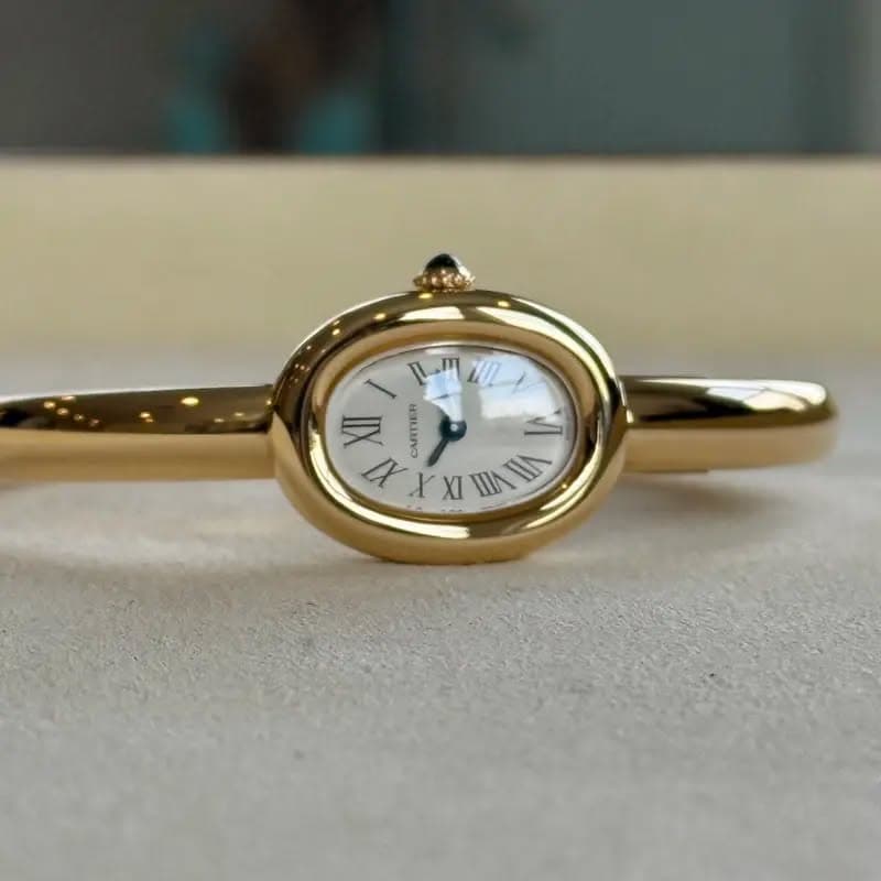 May be an image of wrist watch and jewelry