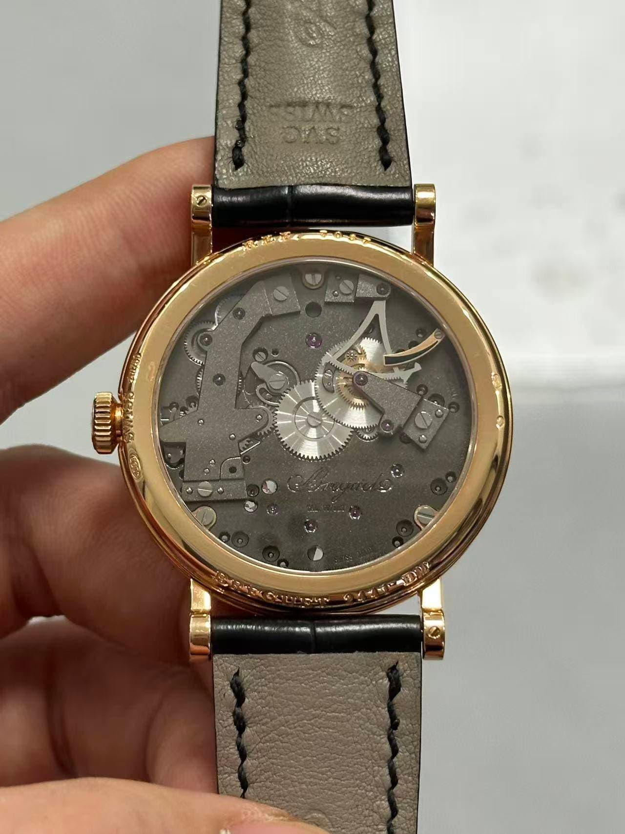 May be an image of wrist watch and text