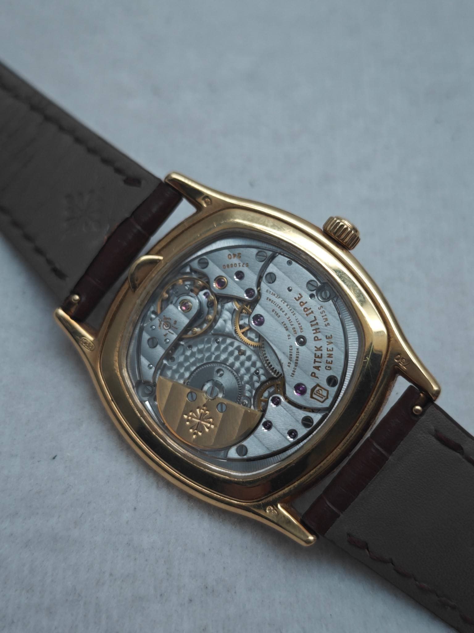 May be an image of wrist watch and text