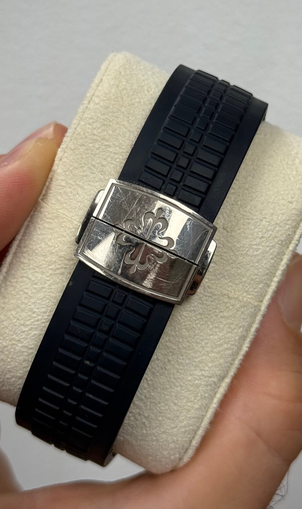 May be an image of jewelry, digital watch and text