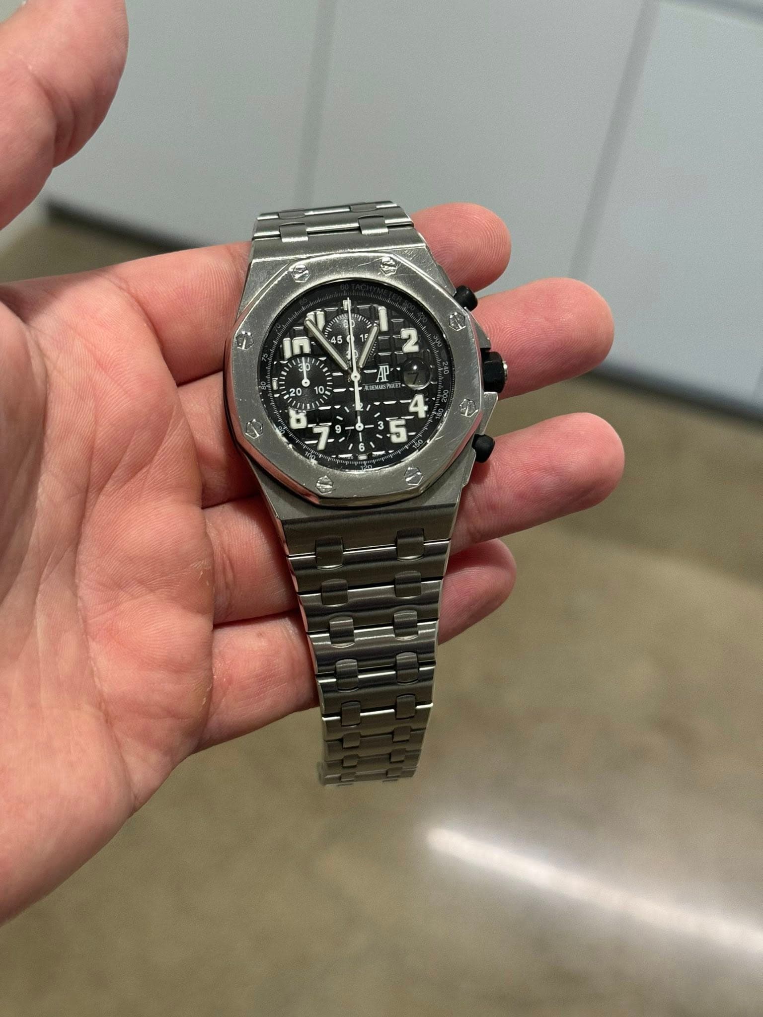 May be an image of wrist watch and text
