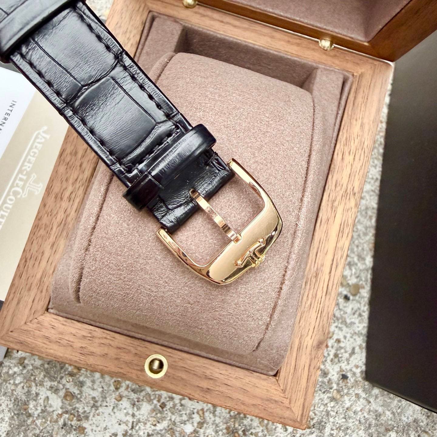 May be an image of saddle-stitched leather, wrist watch and text