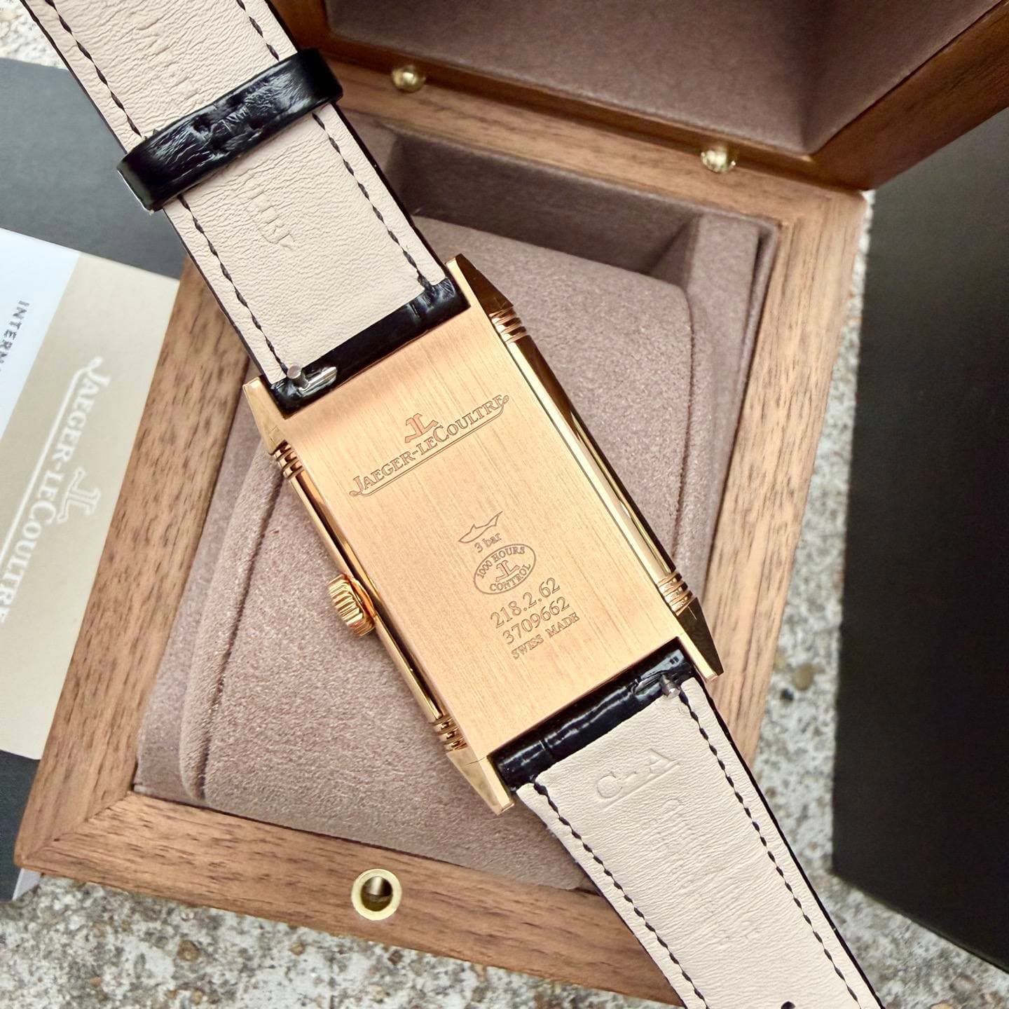 May be an image of wrist watch, saddle-stitched leather and text