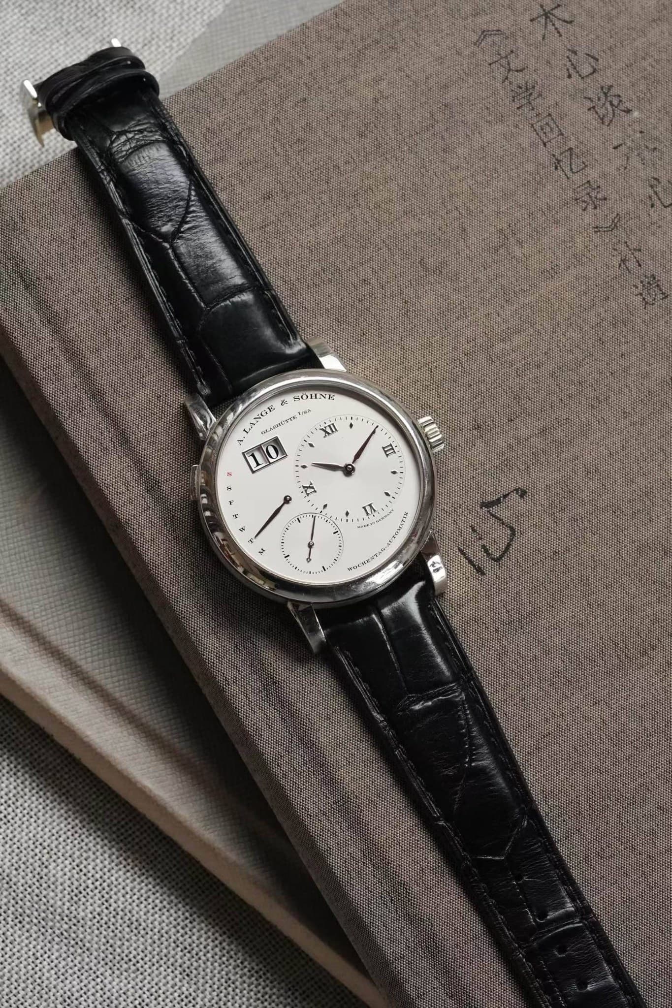 May be an image of wrist watch and text