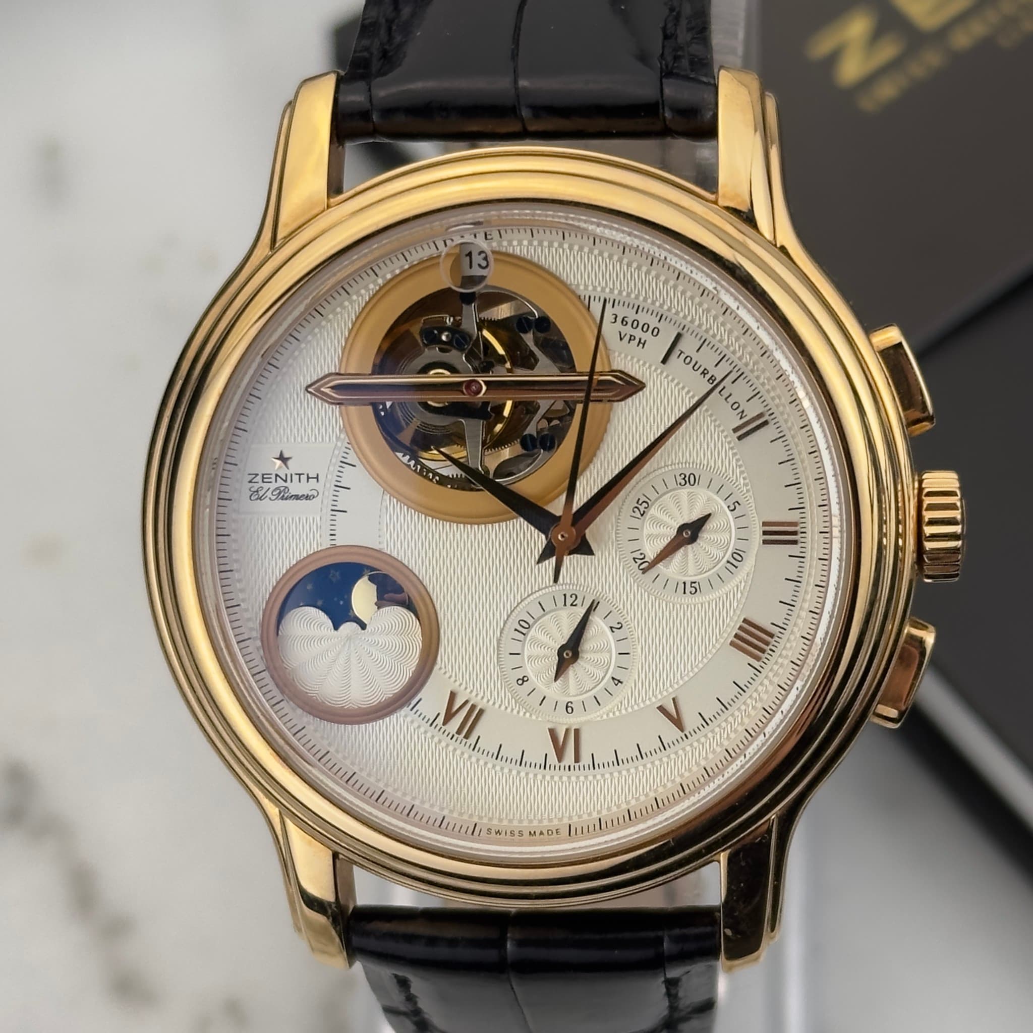 May be an image of wrist watch and text